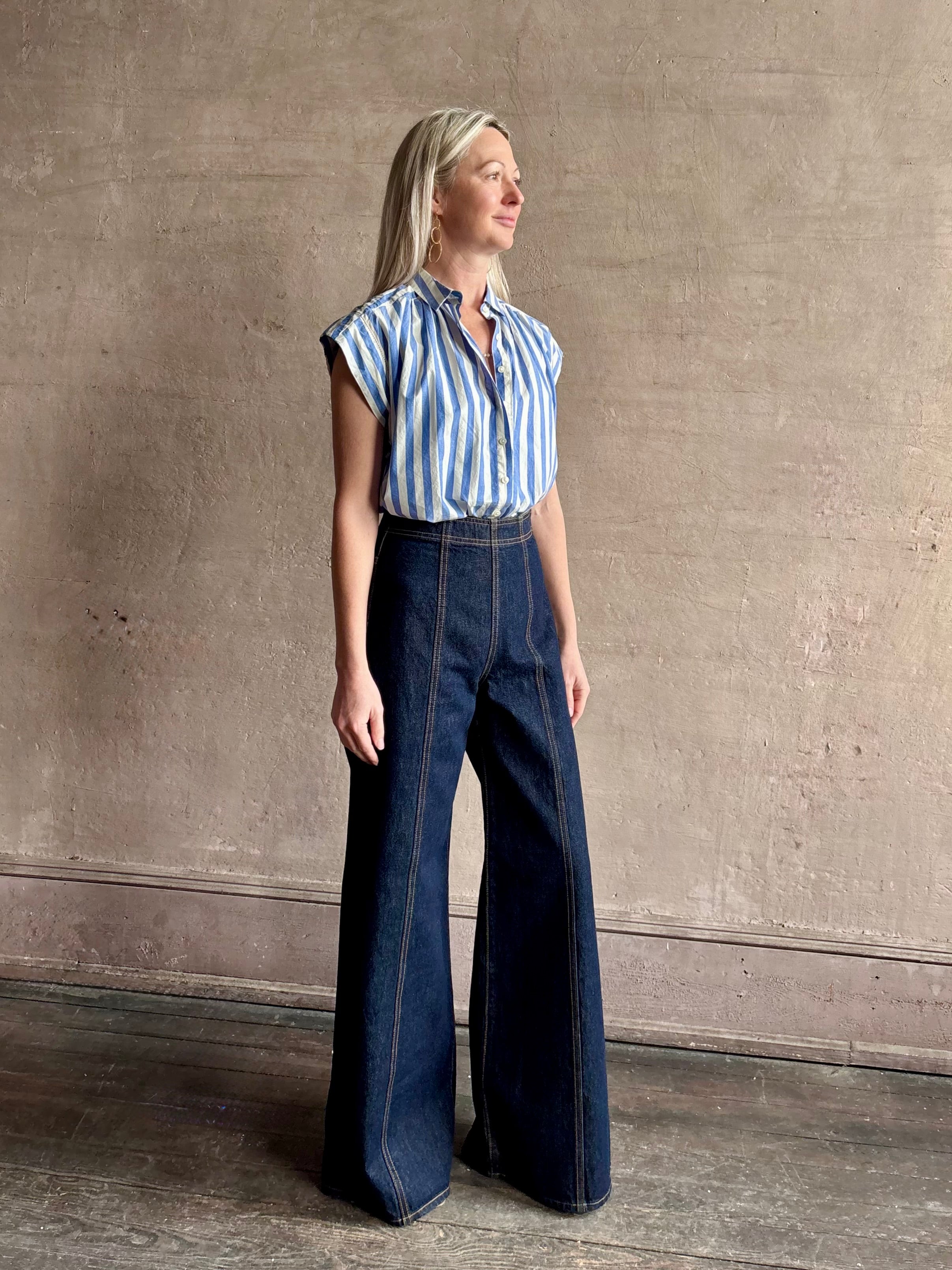 Mature woman wearing elevated everyday short sleeve cotton button-down Della Shirt from Trovata in a playful blue and white summer stripe