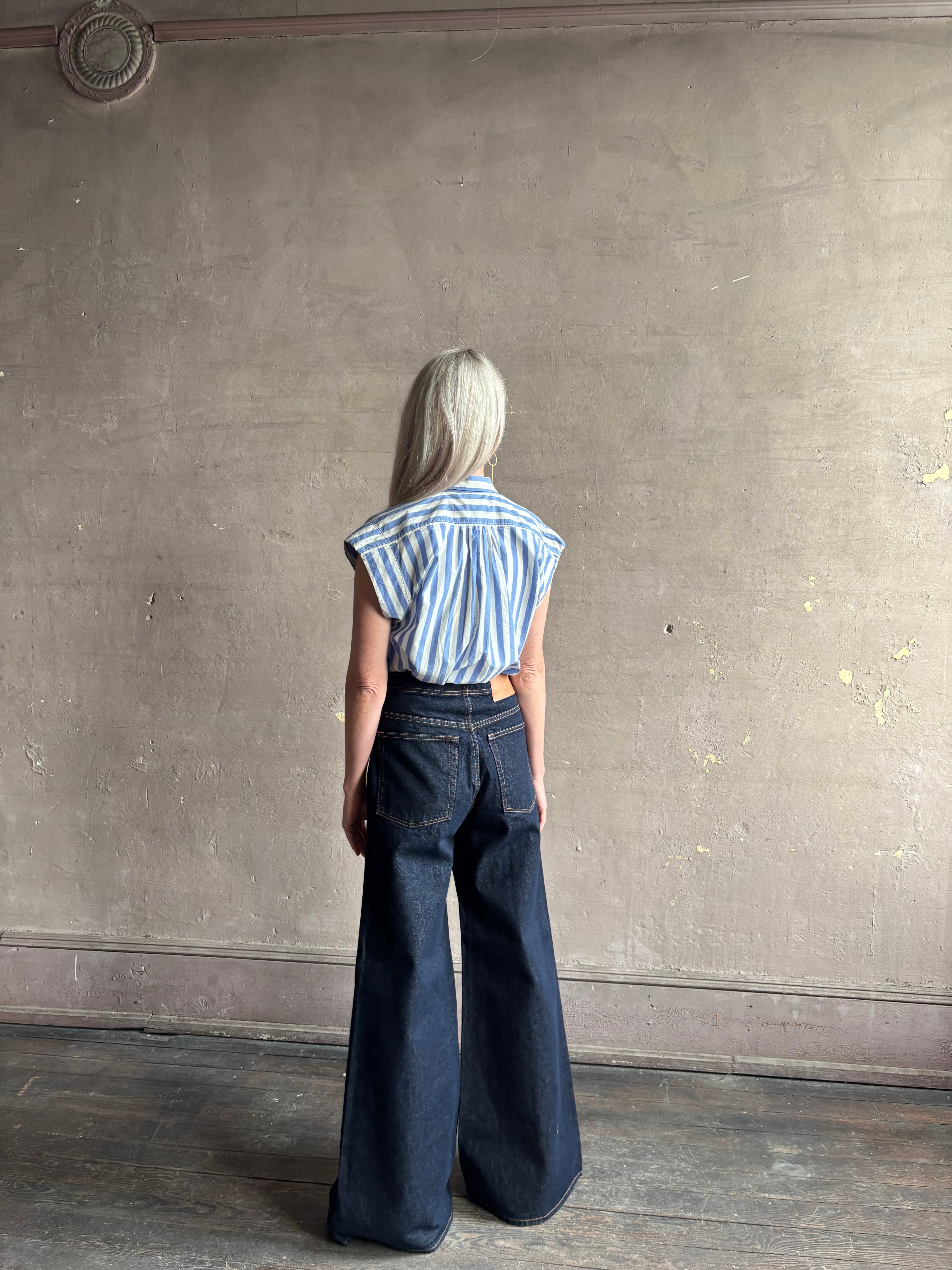 Mature woman wearing elevated everyday short sleeve cotton button-down Della Shirt from Trovata in a playful blue and white summer stripe