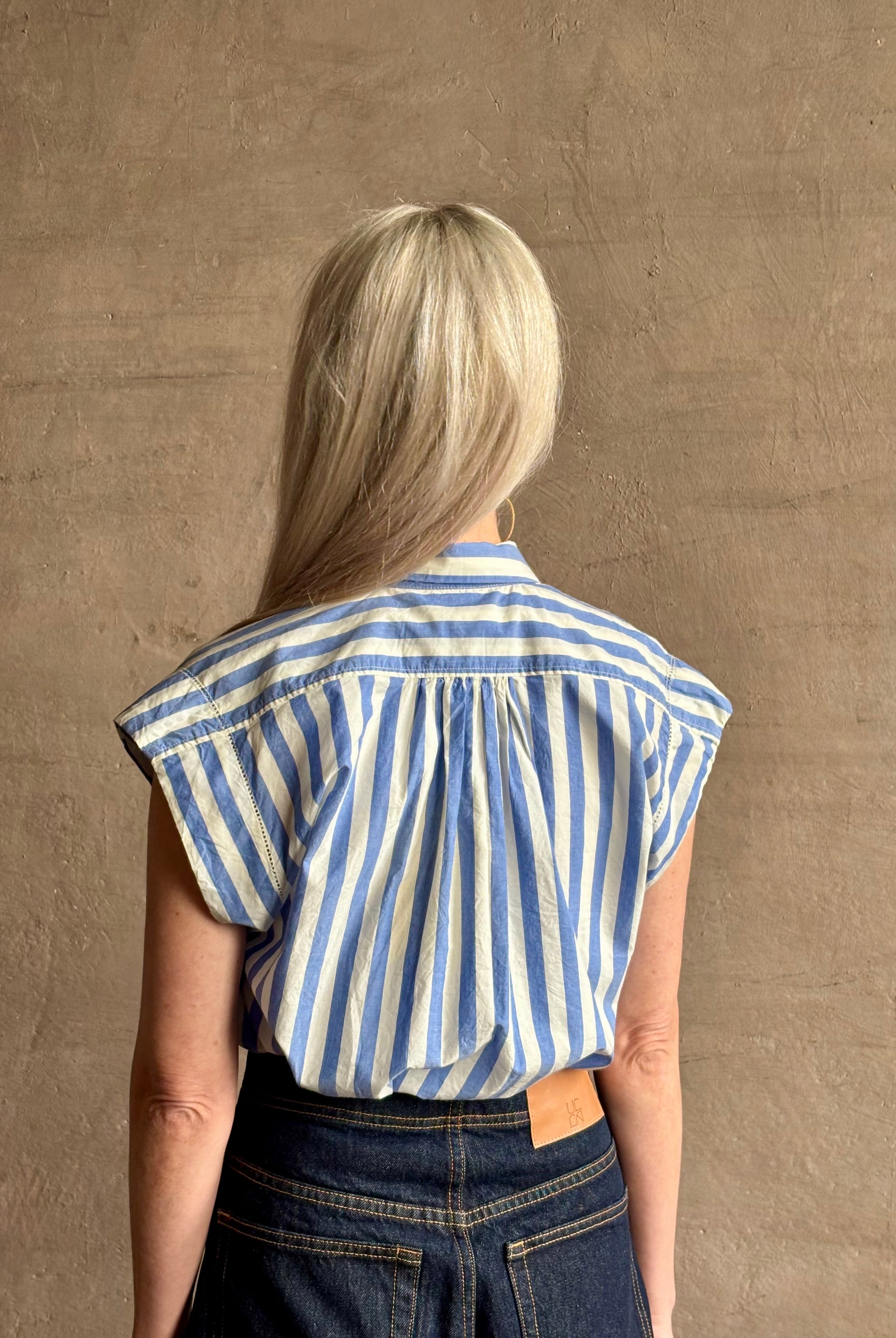 Mature woman wearing elevated everyday short sleeve cotton button-down Della Shirt from Trovata in a playful blue and white summer stripe