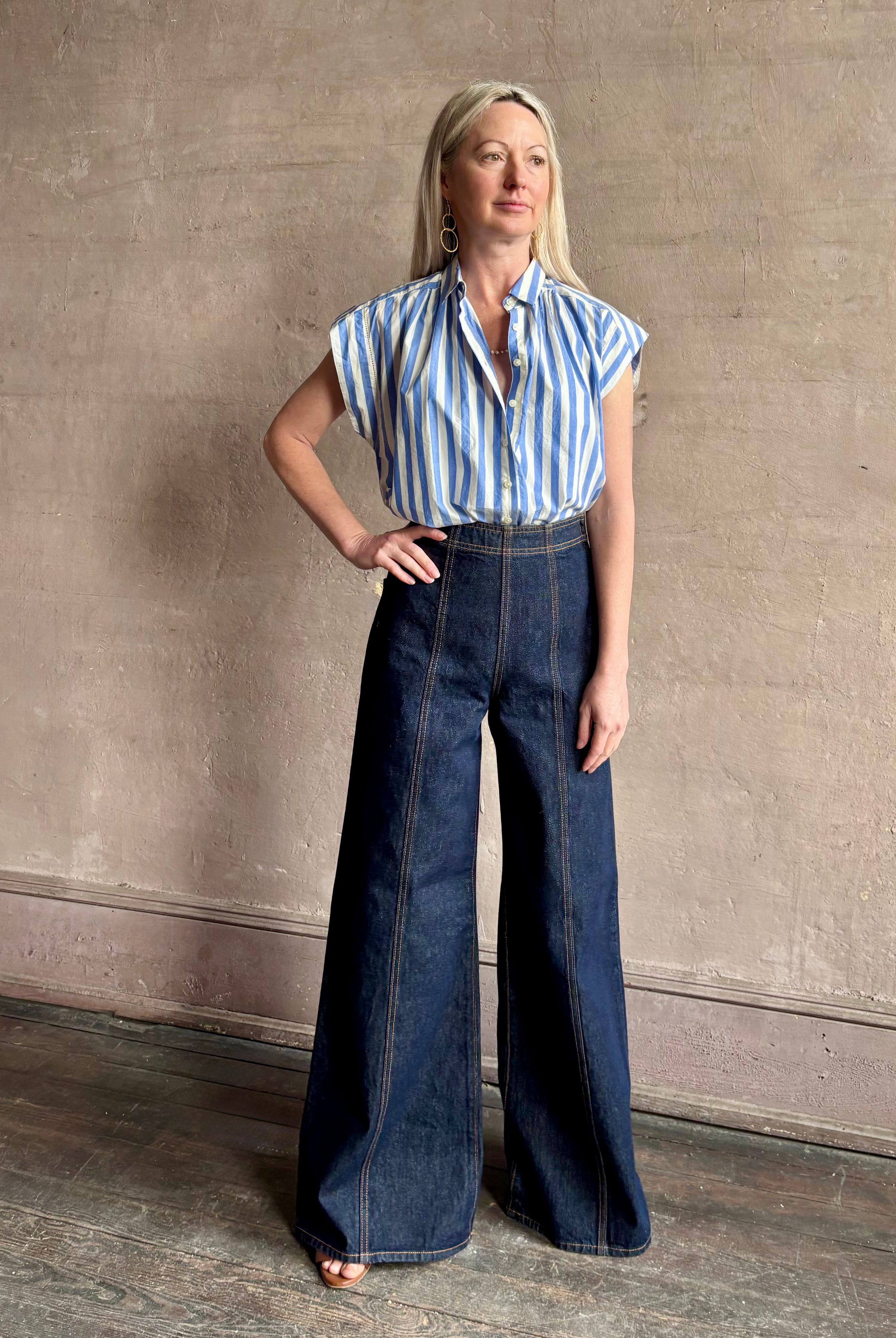 Mature woman wearing elevated everyday short sleeve cotton button-down Della Shirt from Trovata in a playful blue and white summer stripe