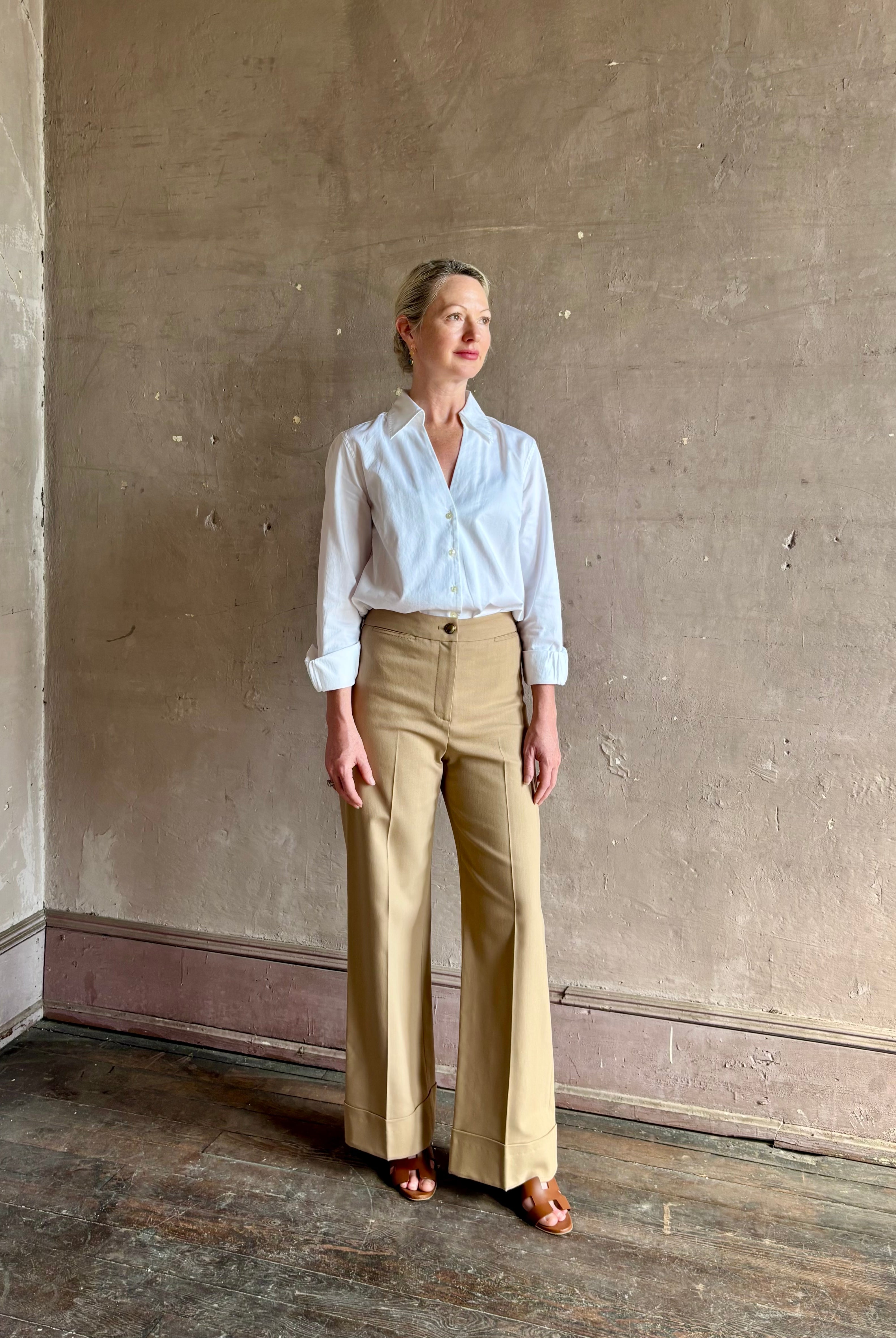 woman wearing white Trovata Justine blouse collared V-neck button-front closure cuffed long sleeves classic silhouette
