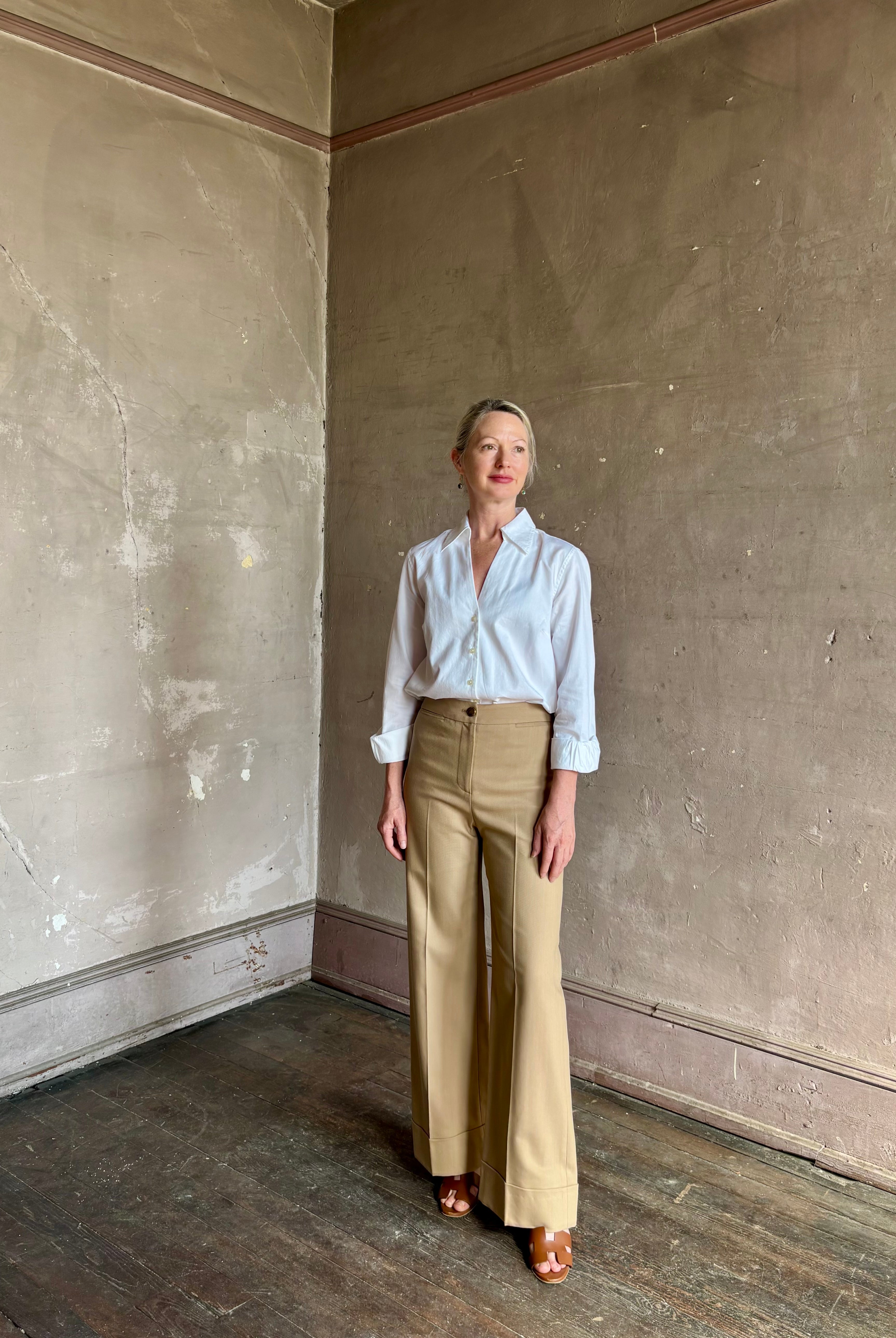 woman wearing white Trovata Justine blouse collared V-neck button-front closure cuffed long sleeves classic silhouette