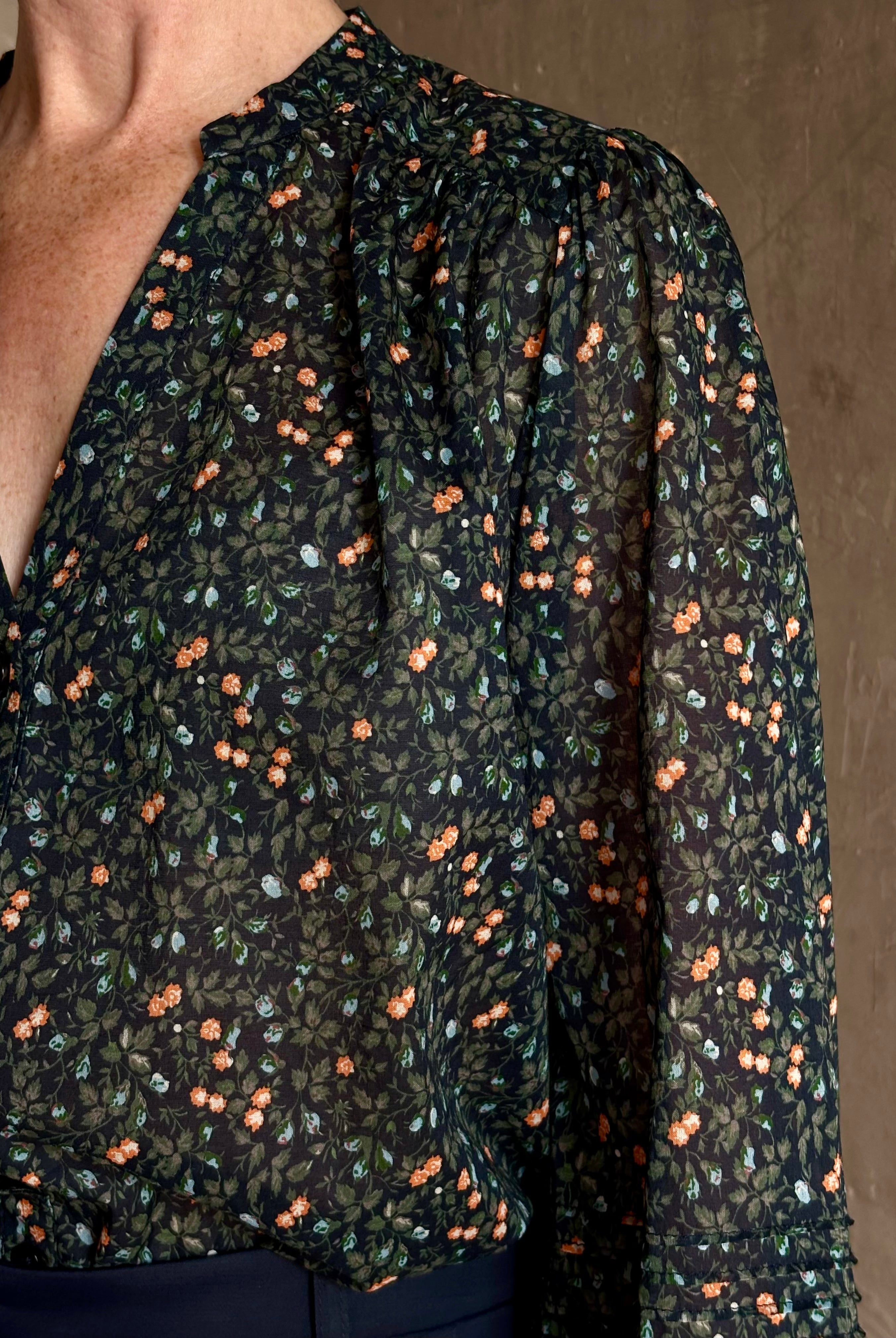 Trovata's Pauline Blouse in Marin Ditsy cotton poplin in navy blue with coral, blue and green small floral print