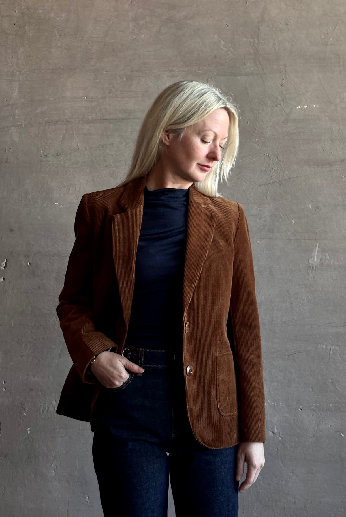 Mature woman wearing Trovata Skylar Cotton Corduroy Two Button Blazer in Walnut Brown front pockets heritage-inspired California tailoring