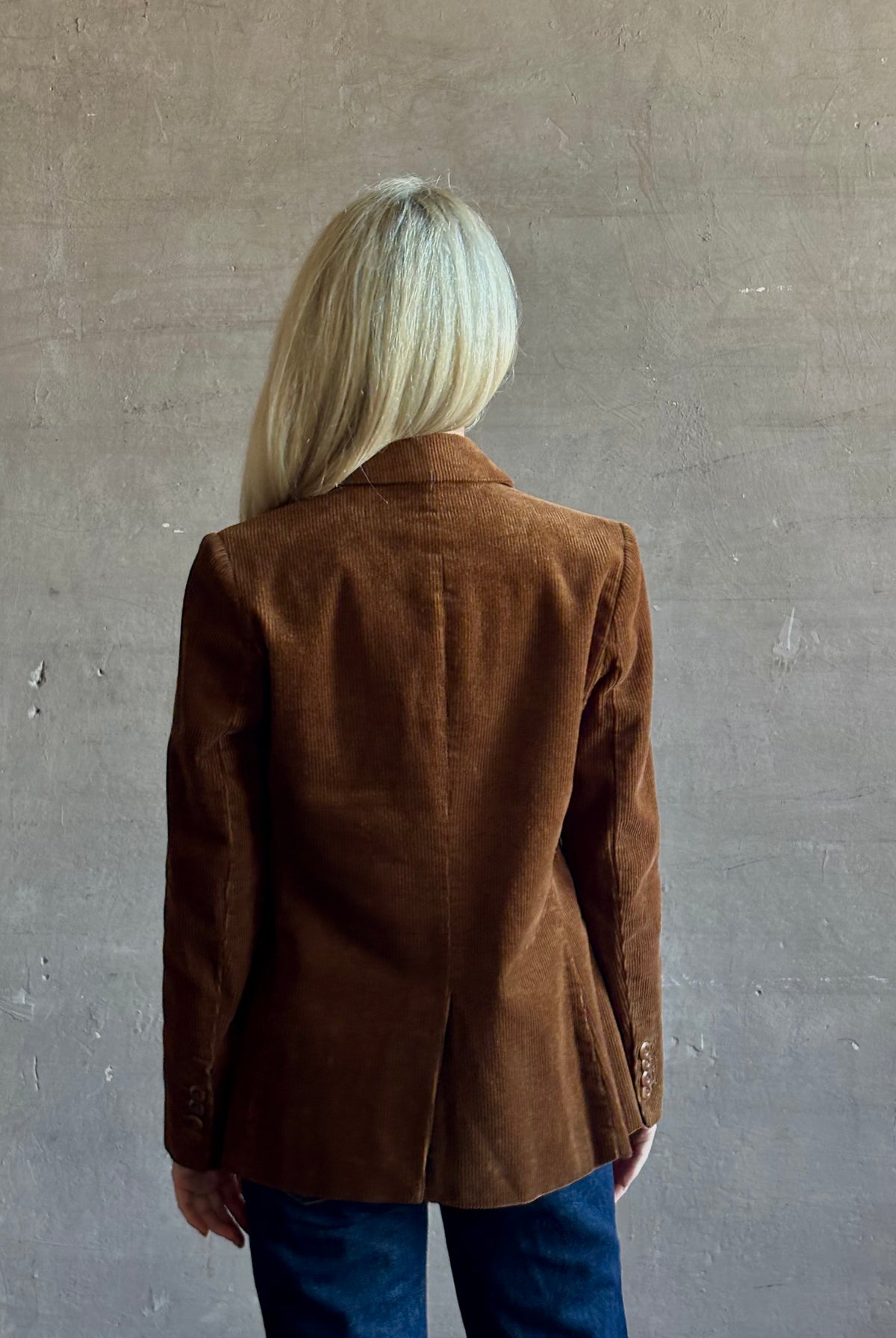 Mature woman wearing Trovata Skylar Cotton Corduroy Two Button Blazer in Walnut Brown front pockets heritage-inspired California tailoring