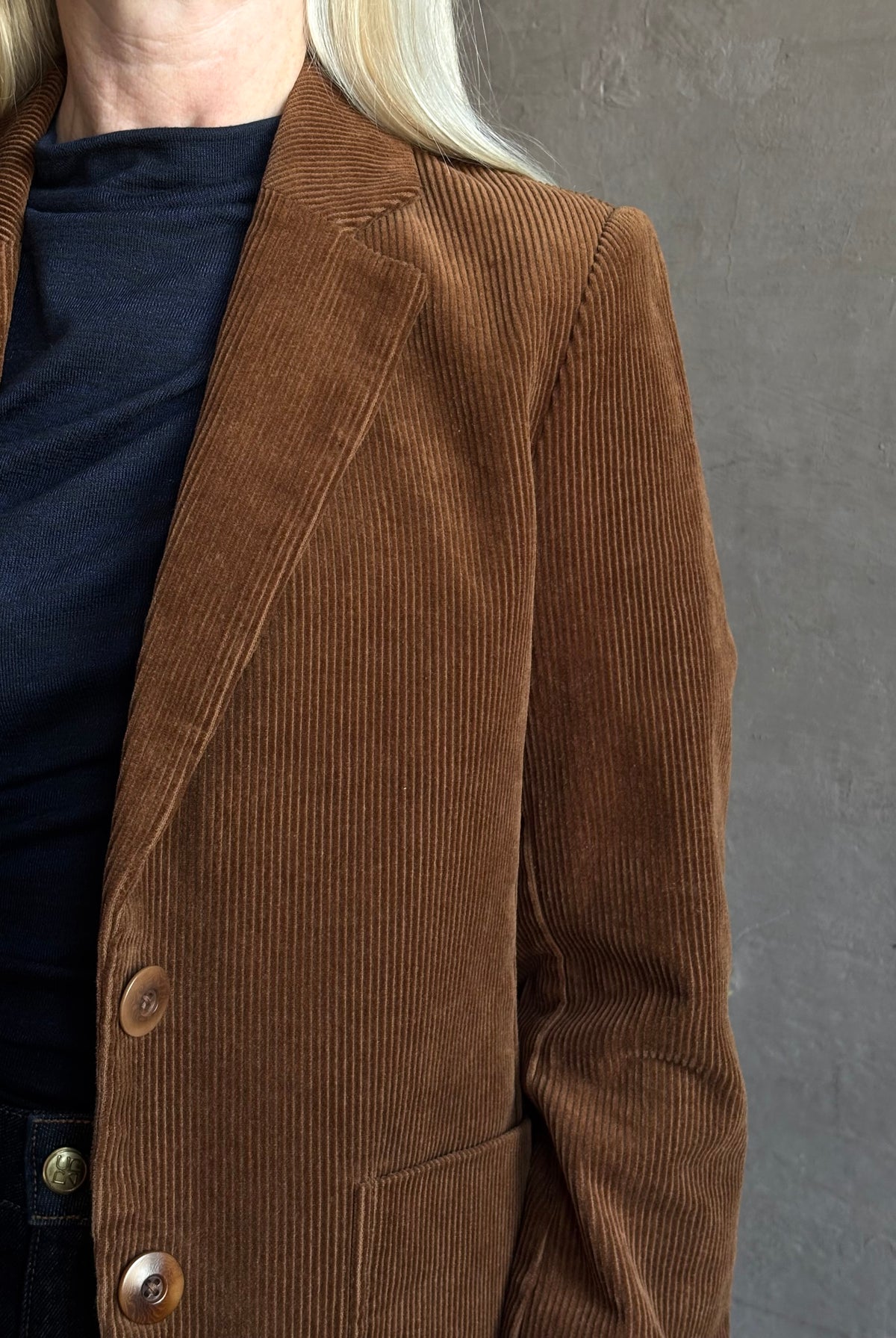 Mature woman wearing Trovata Skylar Cotton Corduroy Two Button Blazer in Walnut Brown front pockets heritage-inspired California tailoring