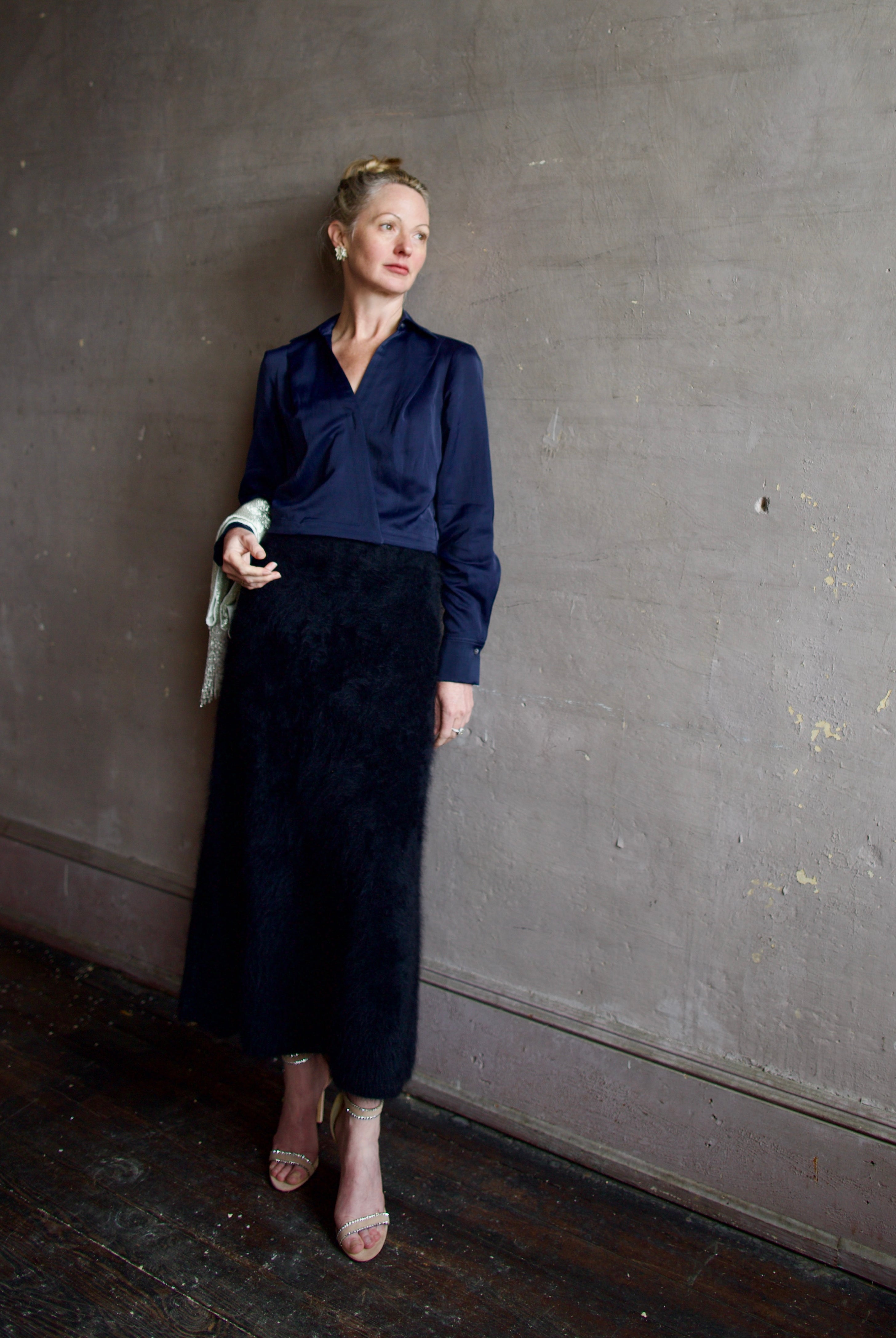 Mature woman wearing luxury women's viscose-linen TWP GT Goan navy blouse featuring cropped fit with wrap waistline and deep v-neckline