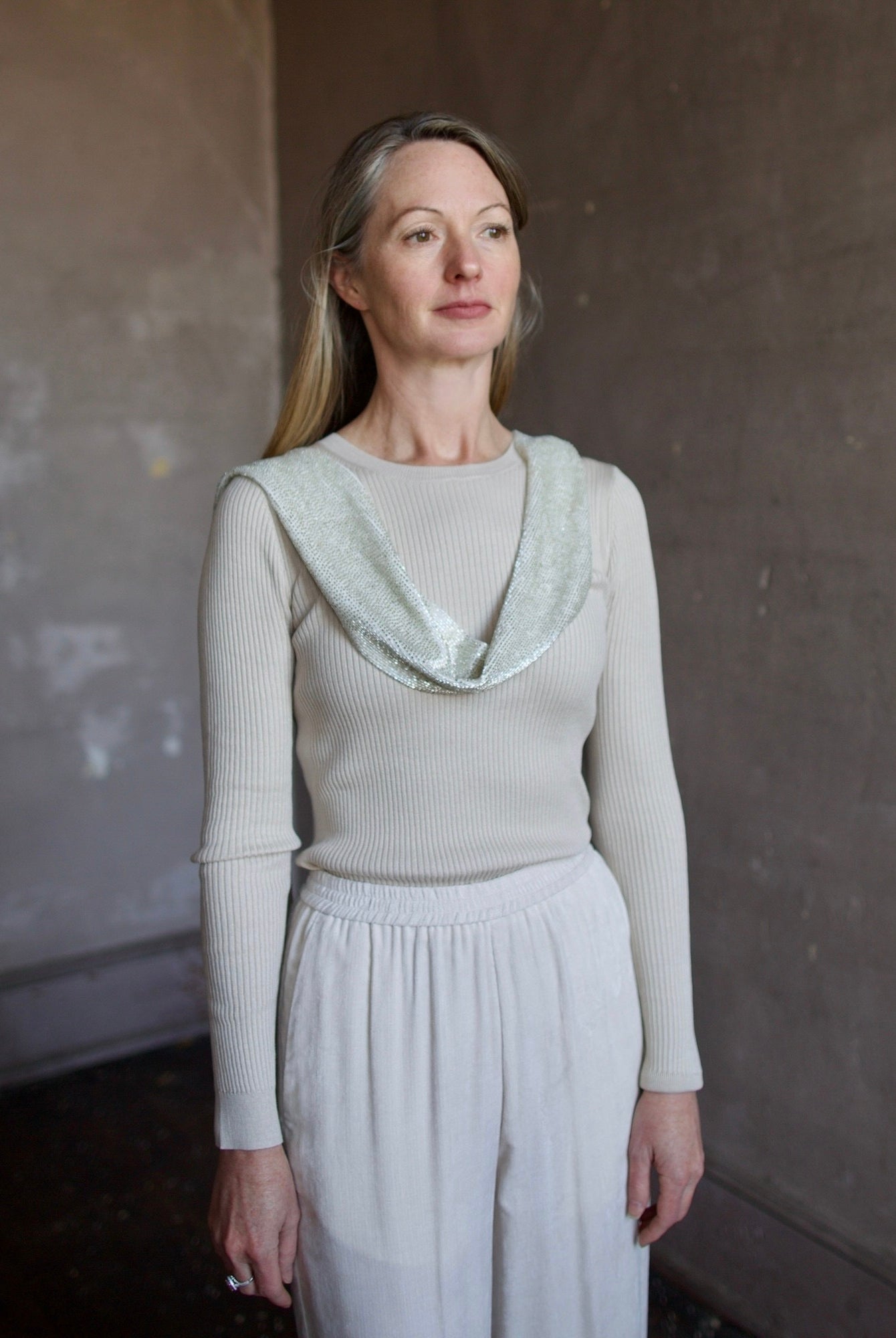 image of a woman wearing the TWP ribbed top and beaded scarf with the Forte Forte corduroy pants