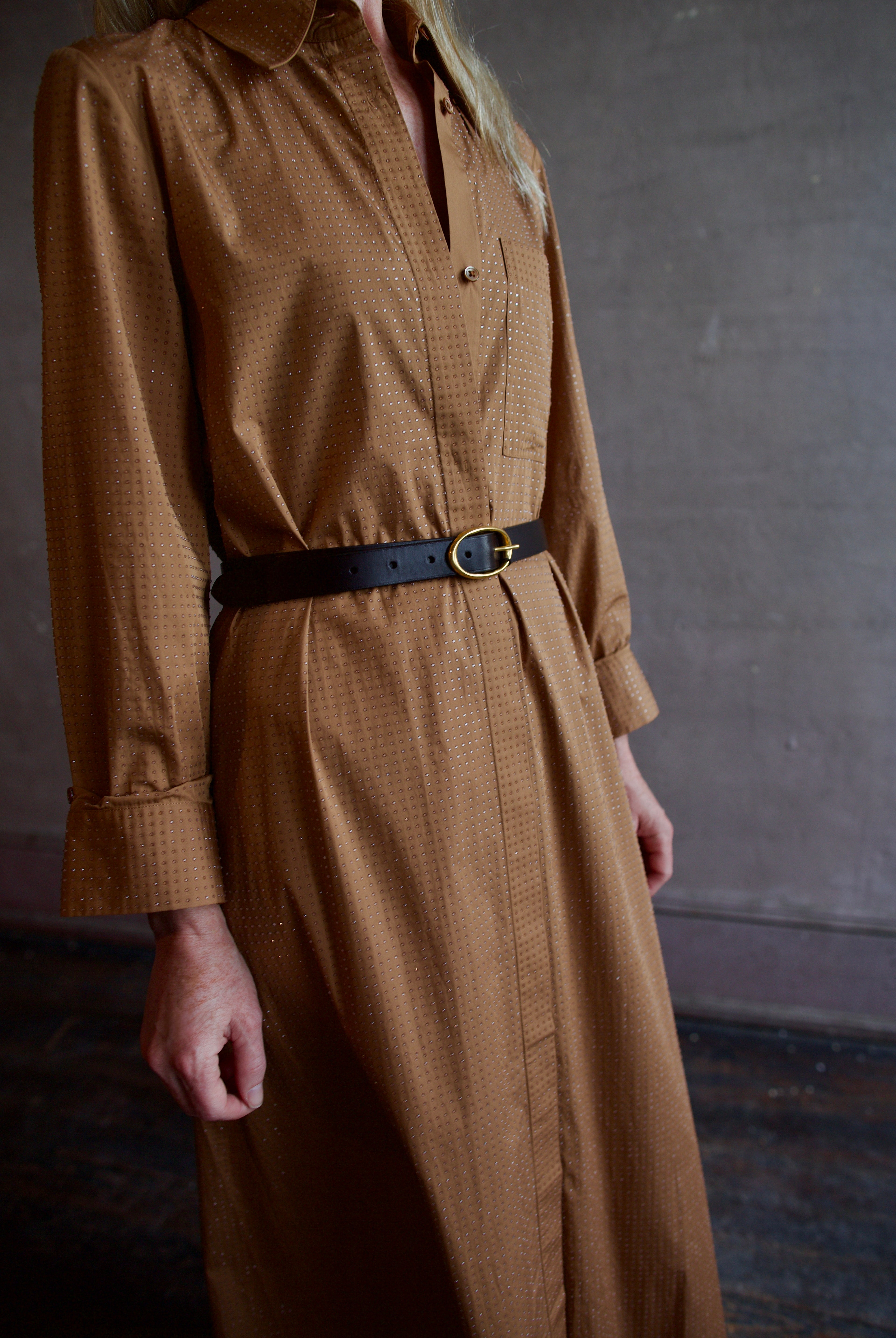 Model wearing the sophisticated TWP Jennys shirt dress embellished with crystals in warm brown styled with a belt