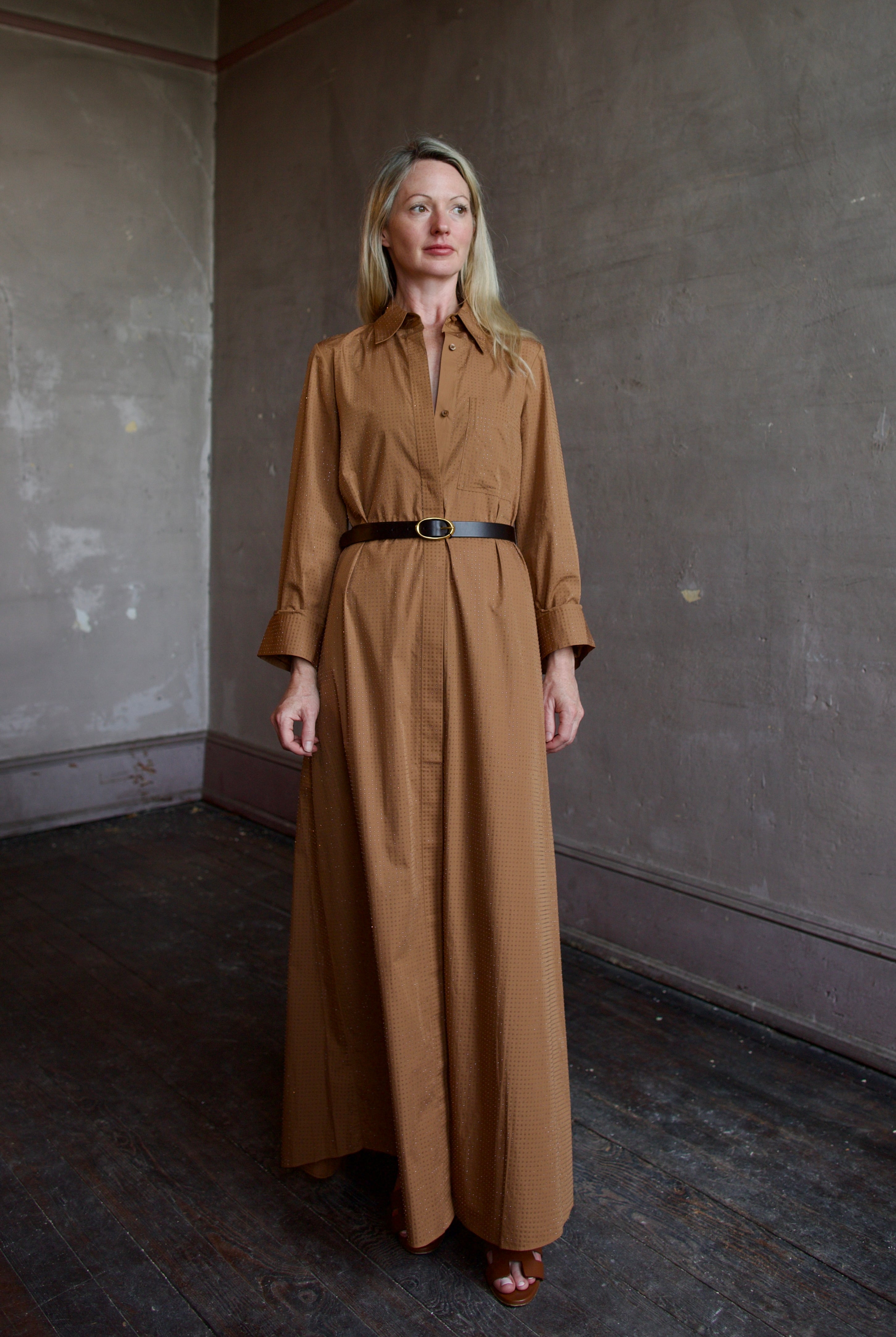 Model wearing the sophisticated TWP Jennys shirt dress embellished with crystals in warm brown and styled with a belt
