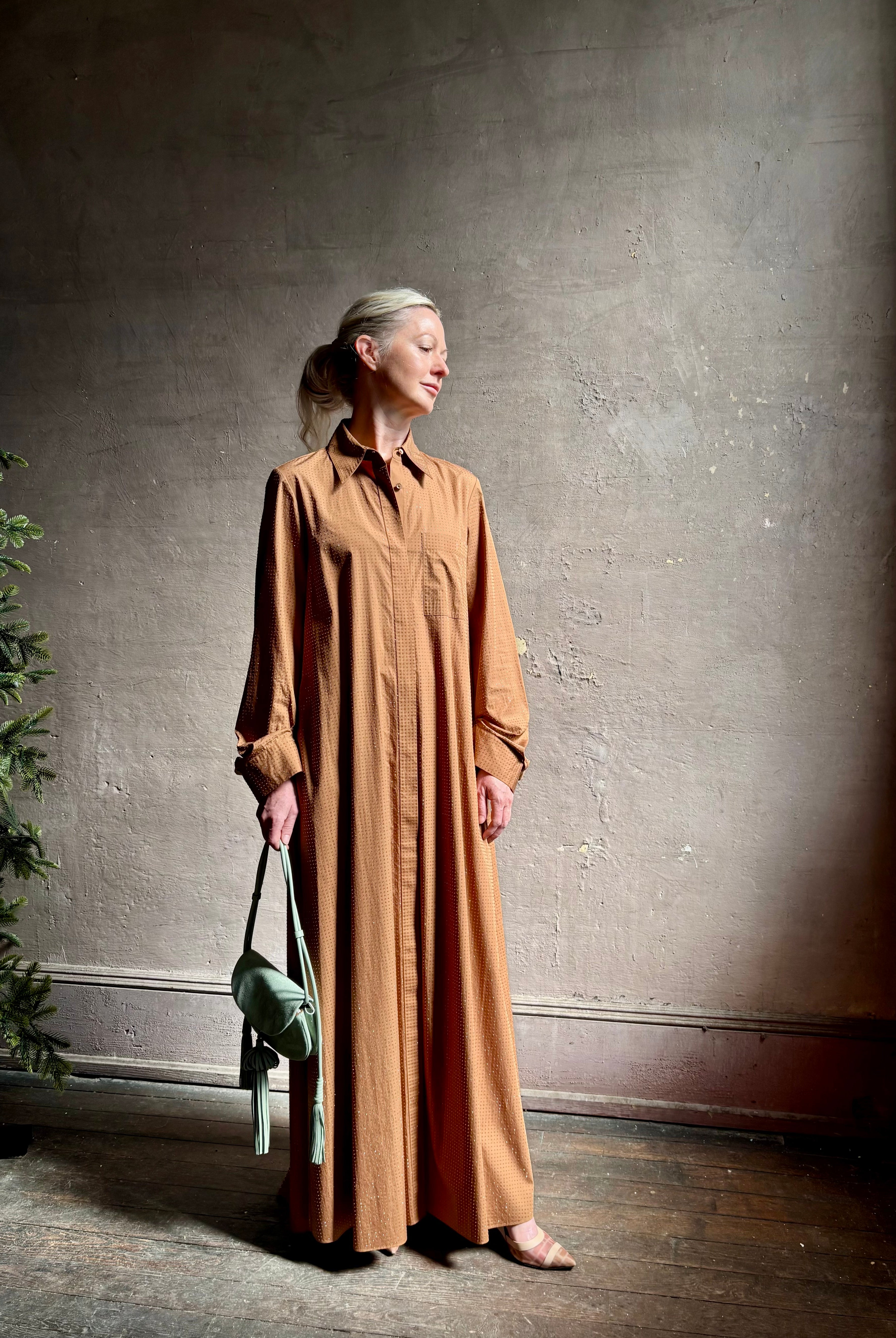 Mature woman wearing luxury TWP Jennys shirt dress embellished with crystals in warm brown