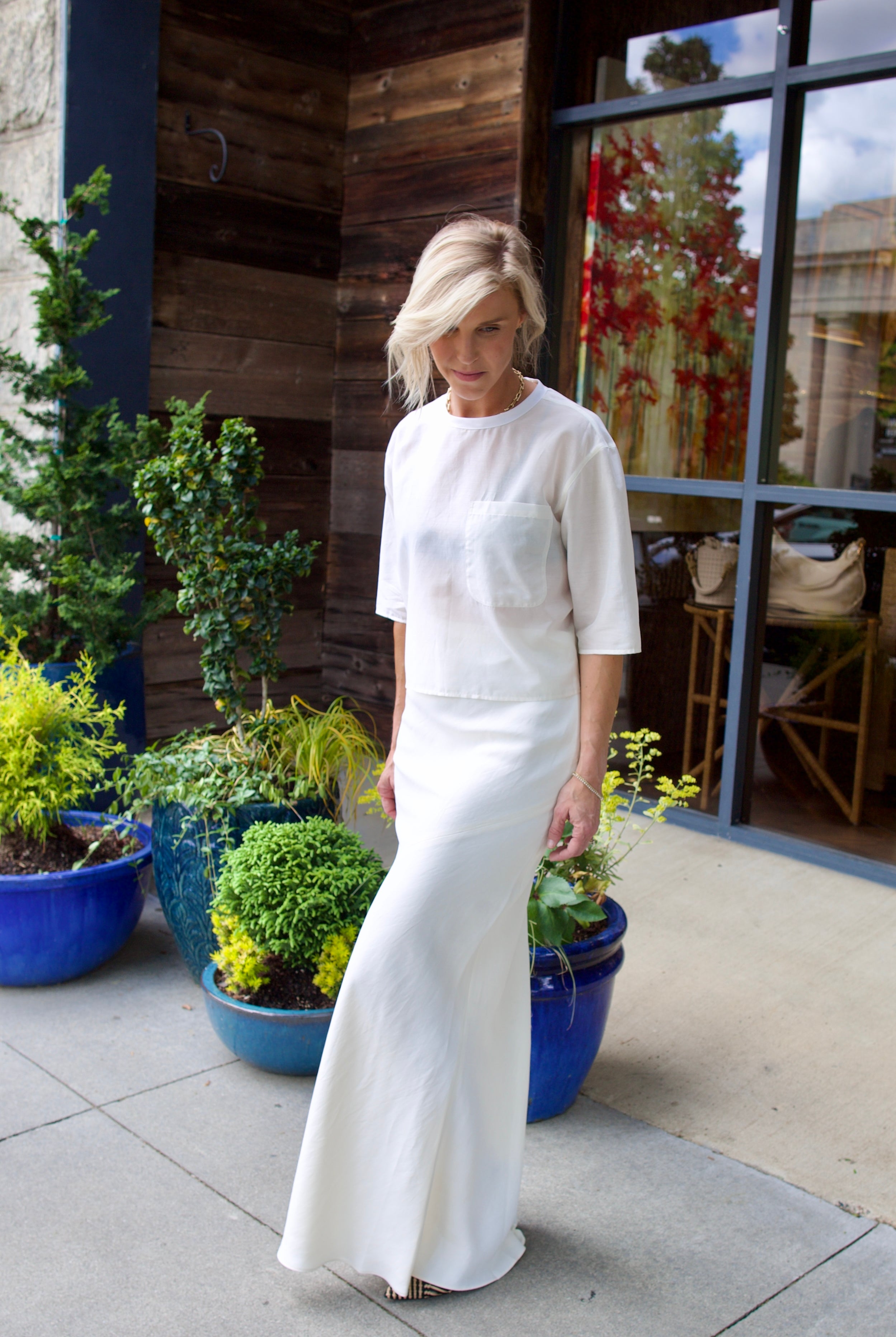 Image of a model wearing luxury TWP coated linen My Endless Love Skirt with expert tailoring for a sophisticated silhouette