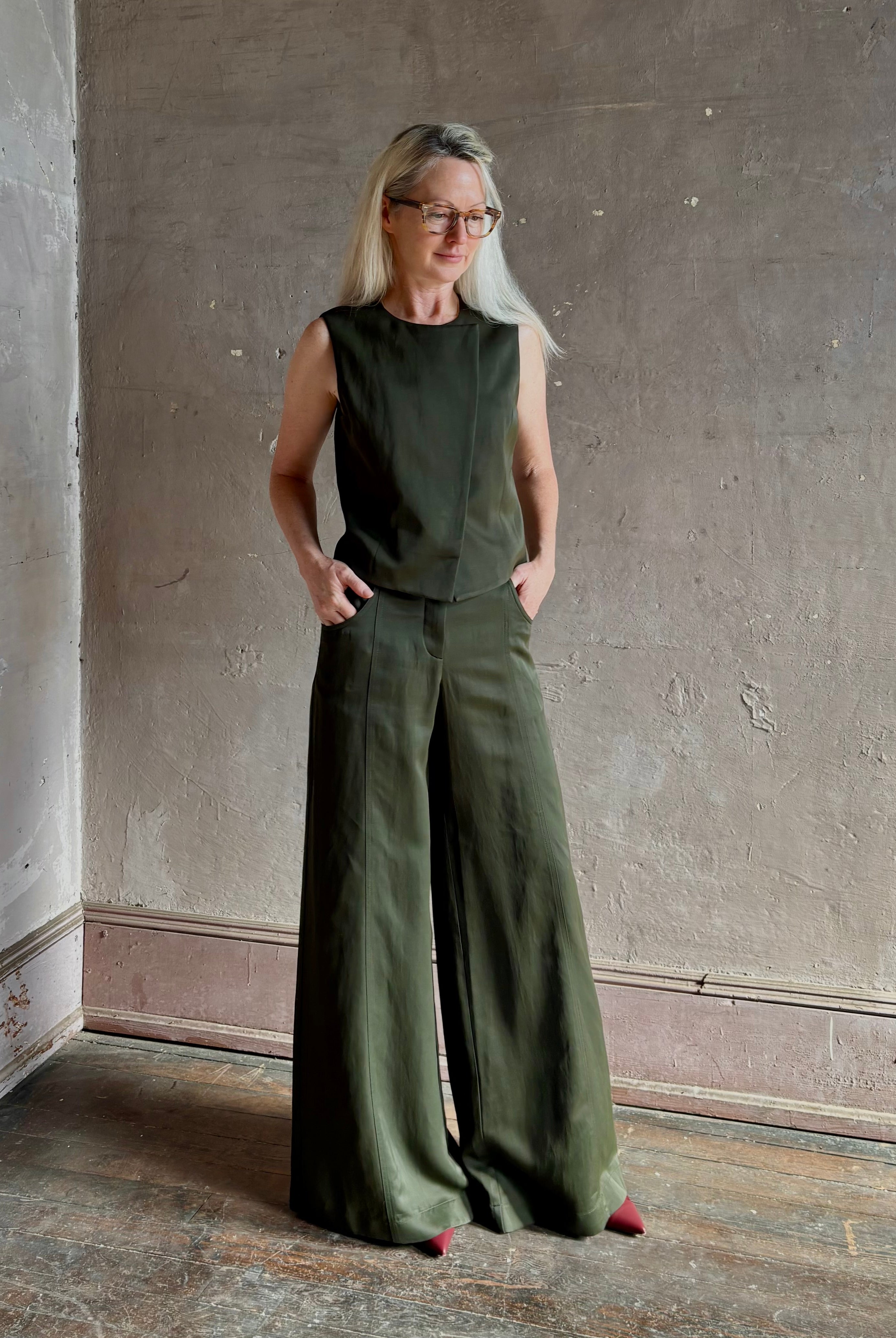 Mature woman wearing luxury women's clothing brand TWP Green Demie wide leg trouser linen viscose blend fabric