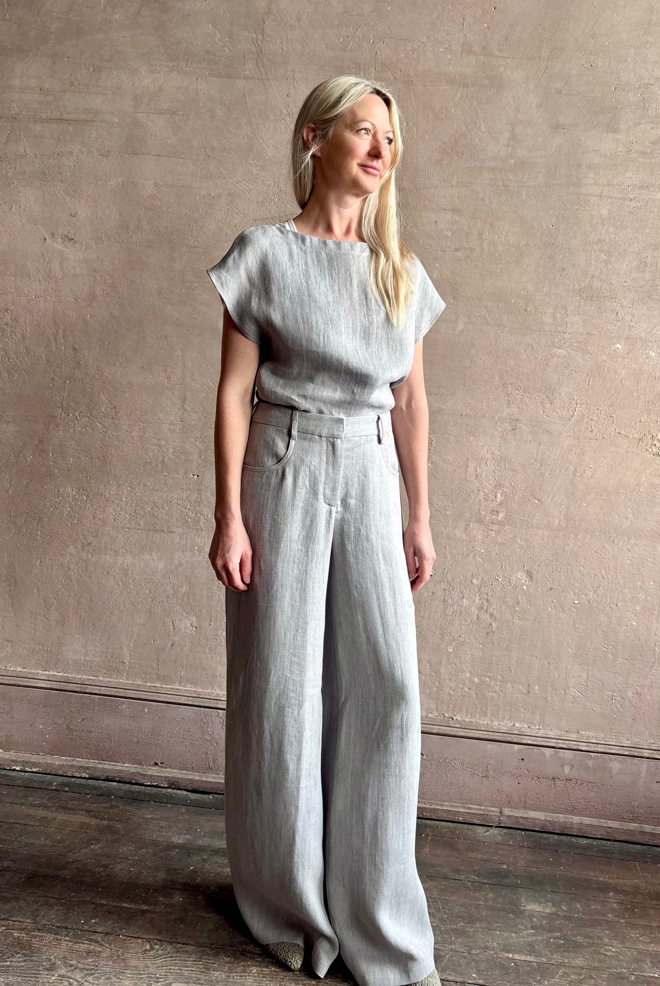 Mature woman wearing the Dillon pant from TWP in an effortlessly sophisticated hemp trouser with an airy wide leg and back pockets
