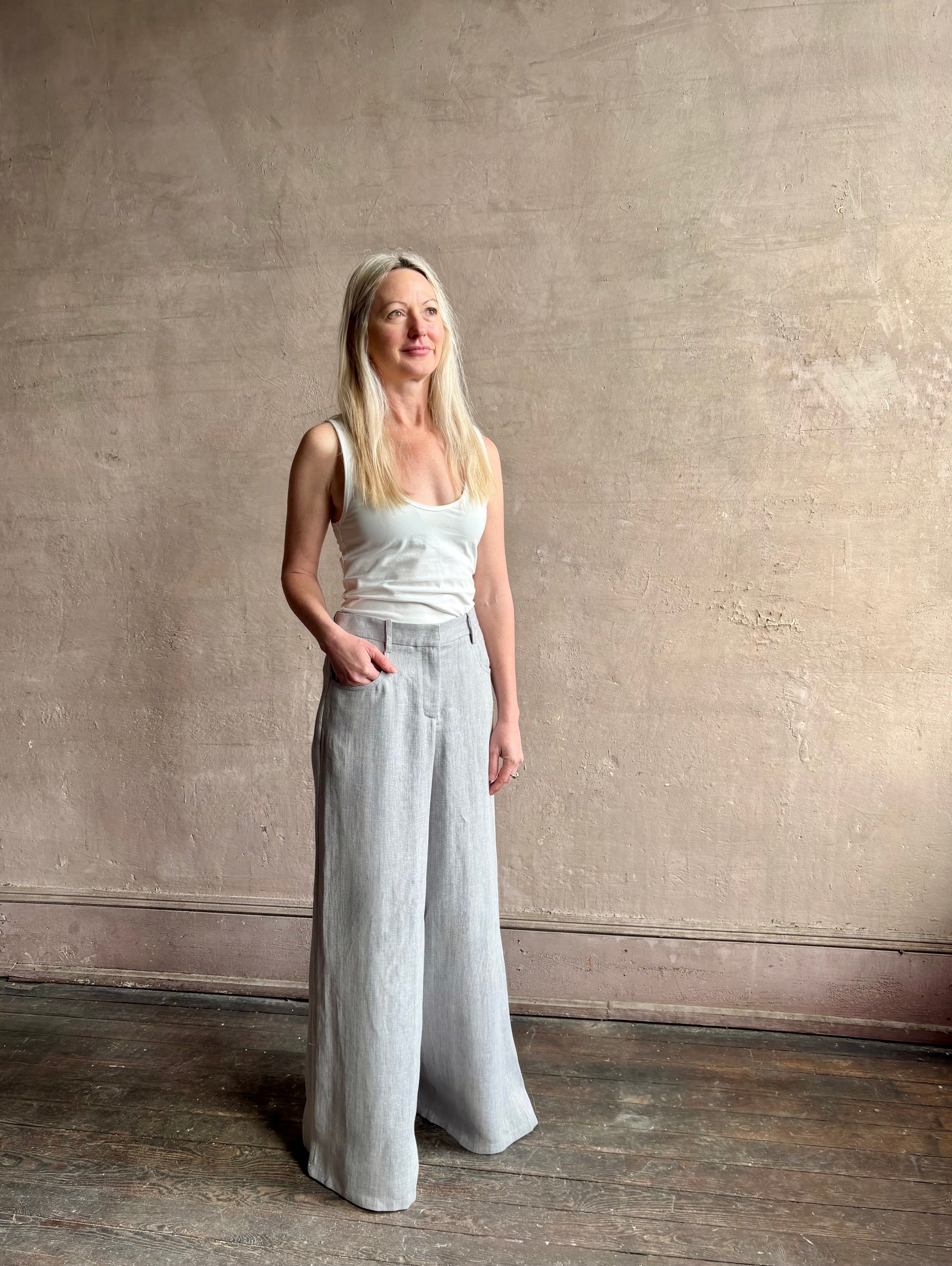 Mature woman wearing the Dillon pant from TWP in an effortlessly sophisticated hemp trouser with an airy wide leg and back pockets