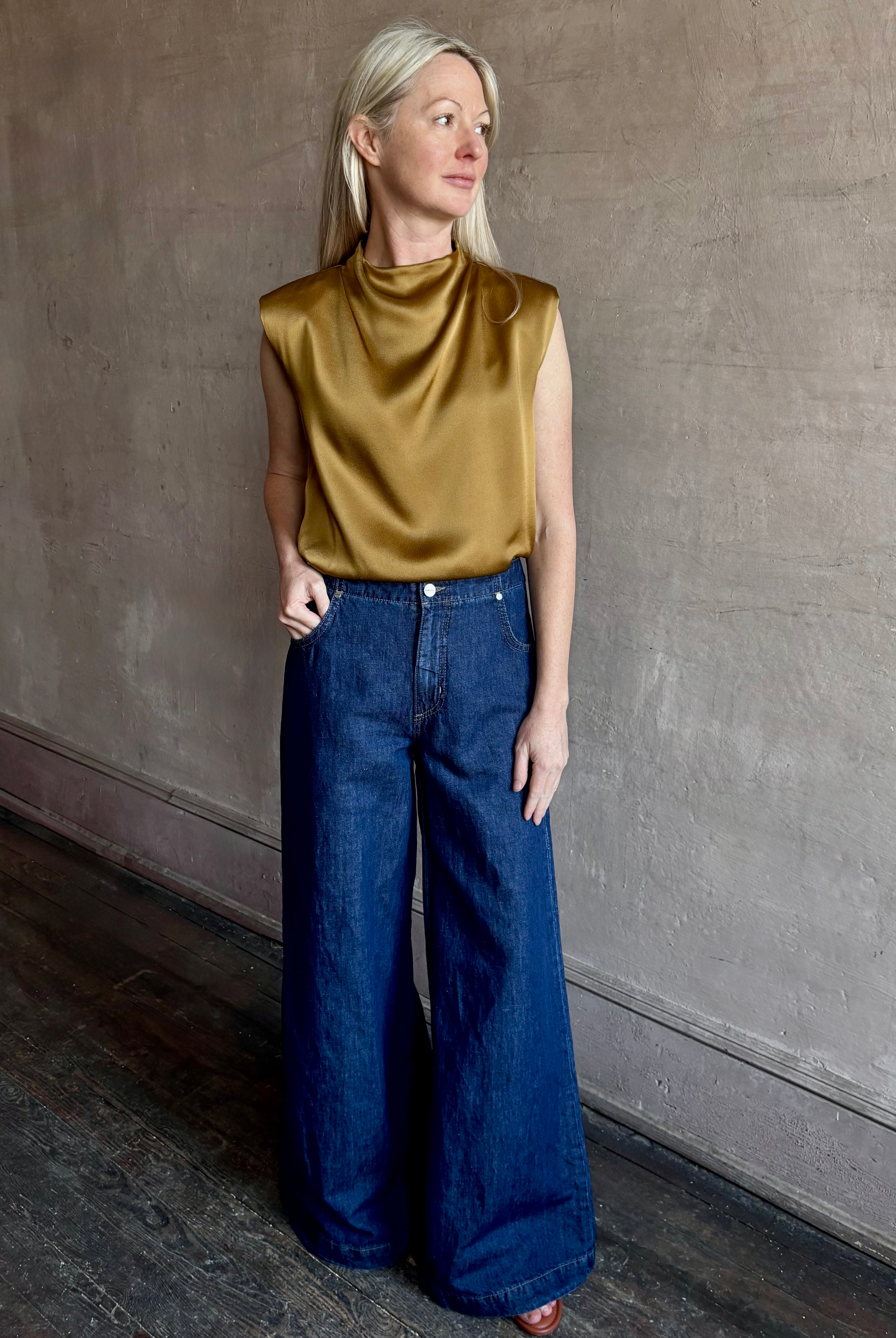 Image of woman wearing designer TWP Dillon cotton linen Denim in Dark Stone wash that is Made in USA with mid-rise and wide leg