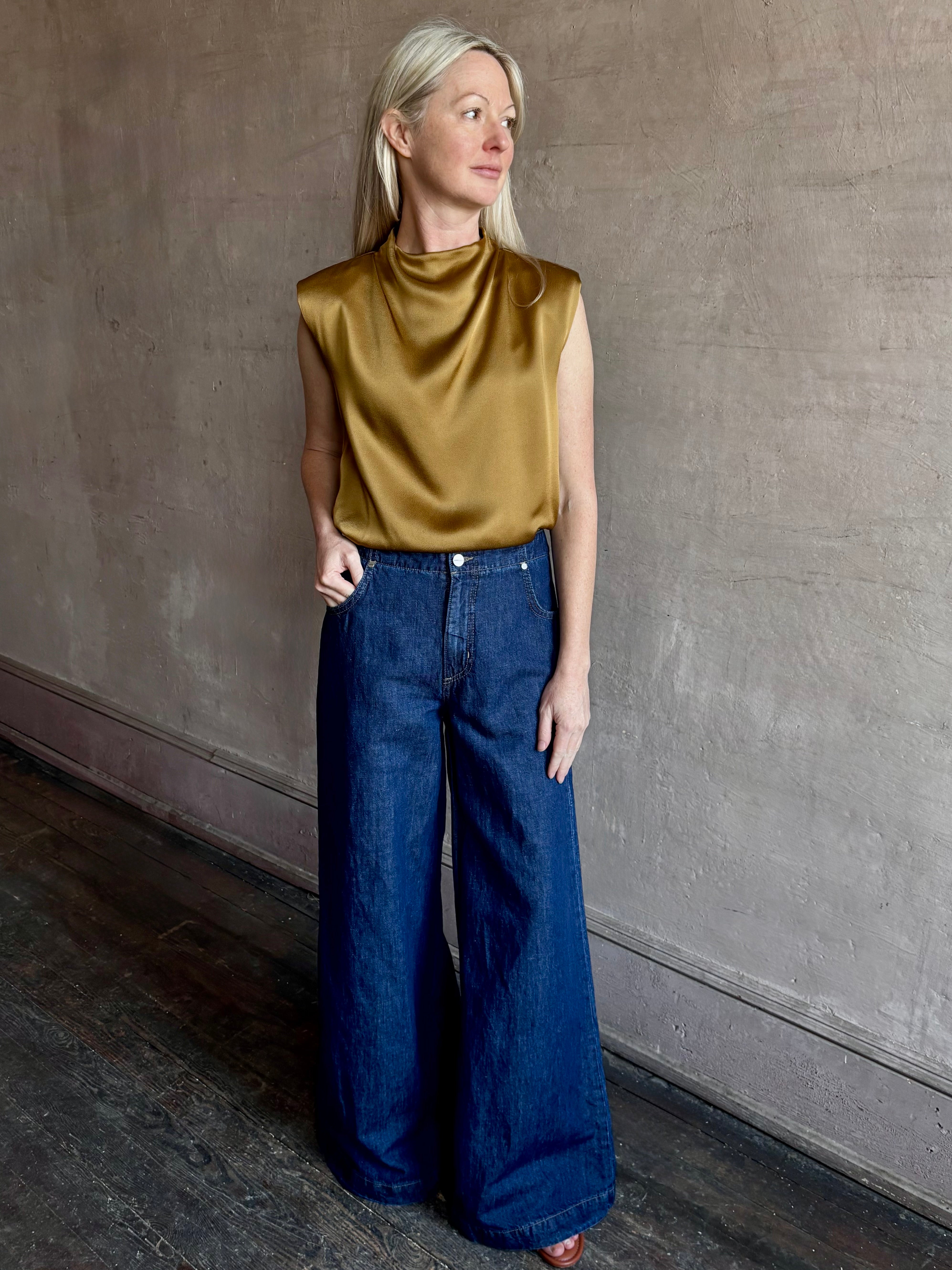 Image of woman wearing designer TWP Dillon cotton linen Denim in Dark Stone wash that is Made in USA with mid-rise and wide leg