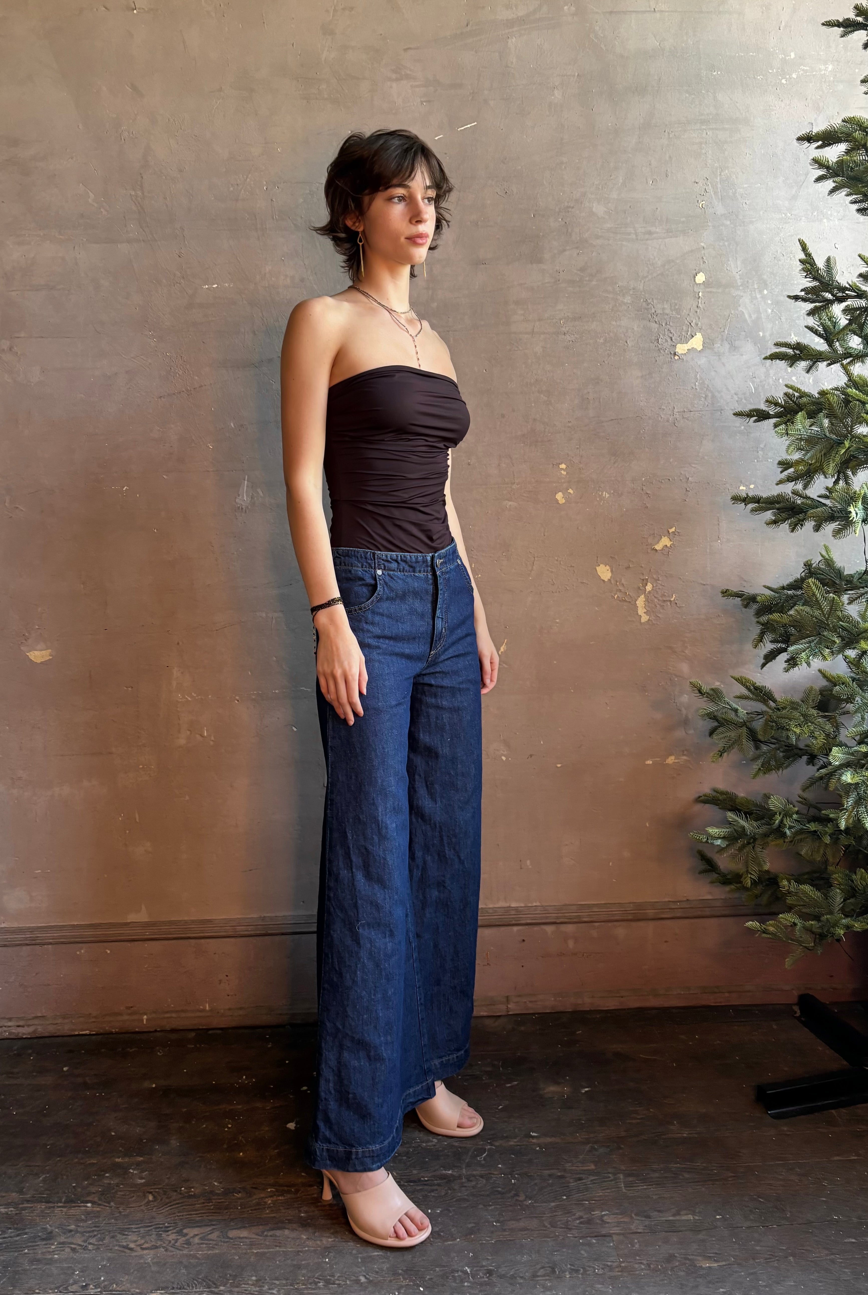 Woman wearing luxury designer TWP Dillon cotton linen Denim in Dark Stone wash that is Made in USA with mid-rise and wide leg