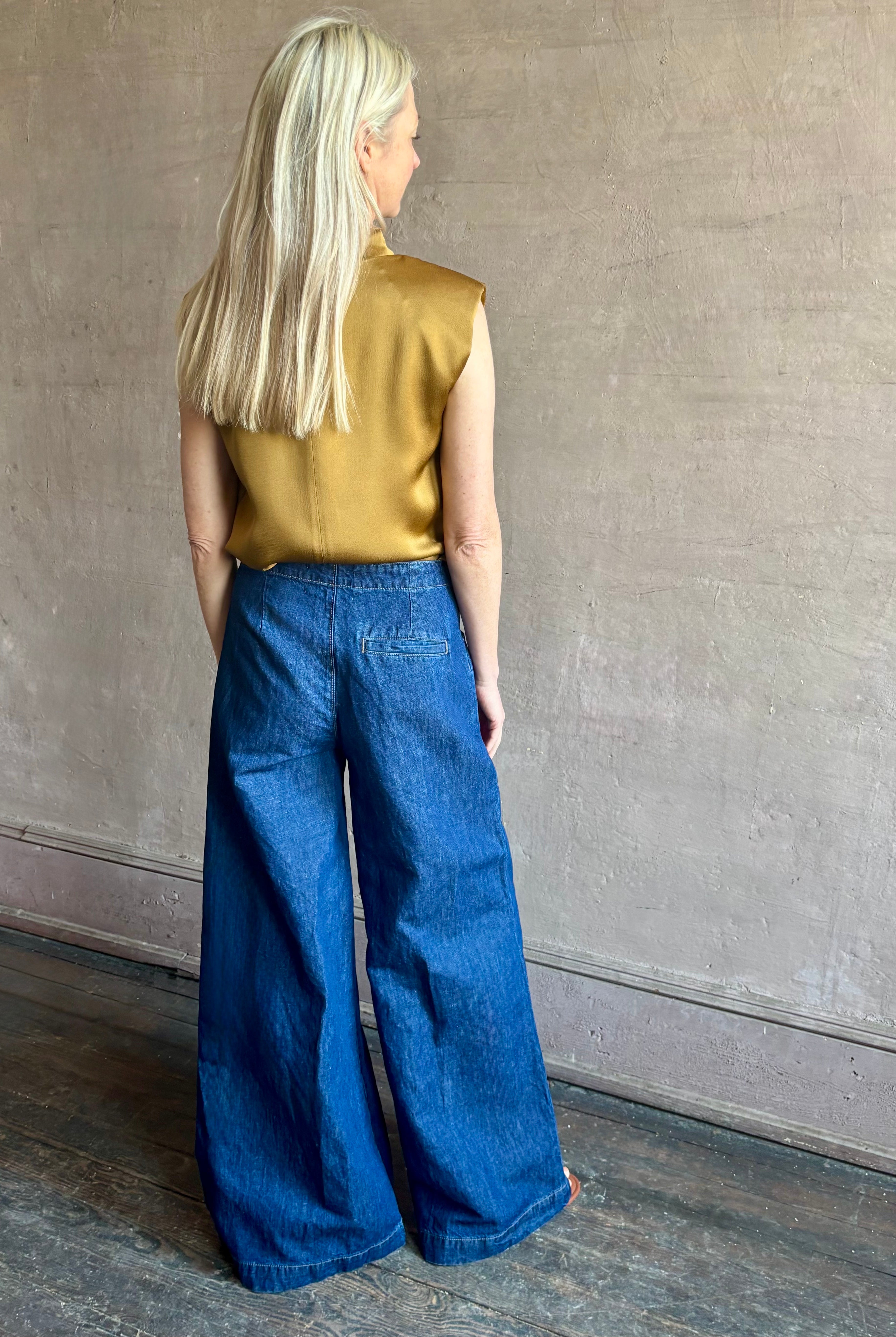 Image of woman wearing designer TWP Dillon cotton linen Denim in Dark Stone wash that is Made in USA with mid-rise and wide leg