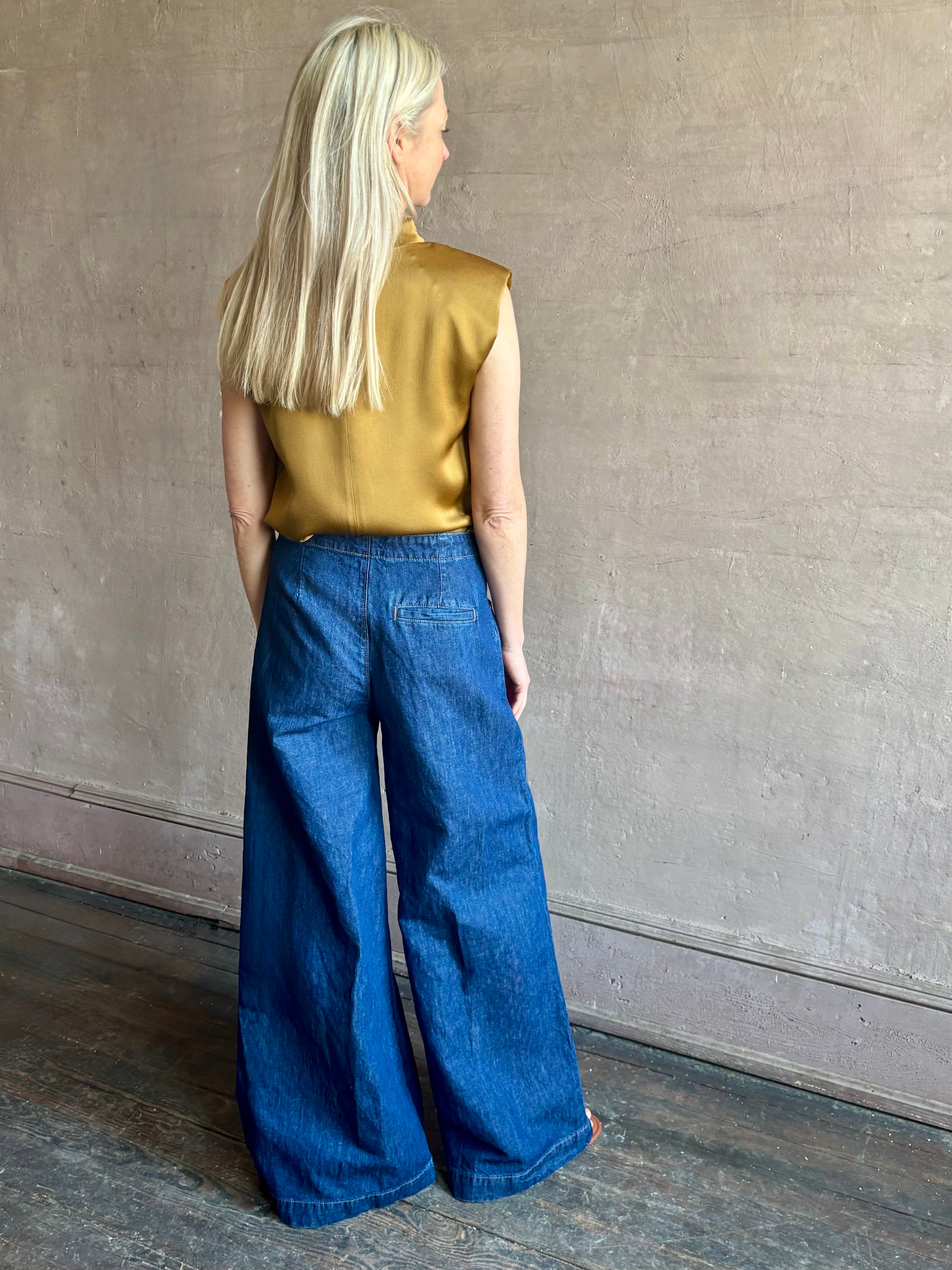 Image of woman wearing designer TWP Dillon cotton linen Denim in Dark Stone wash that is Made in USA with mid-rise and wide leg