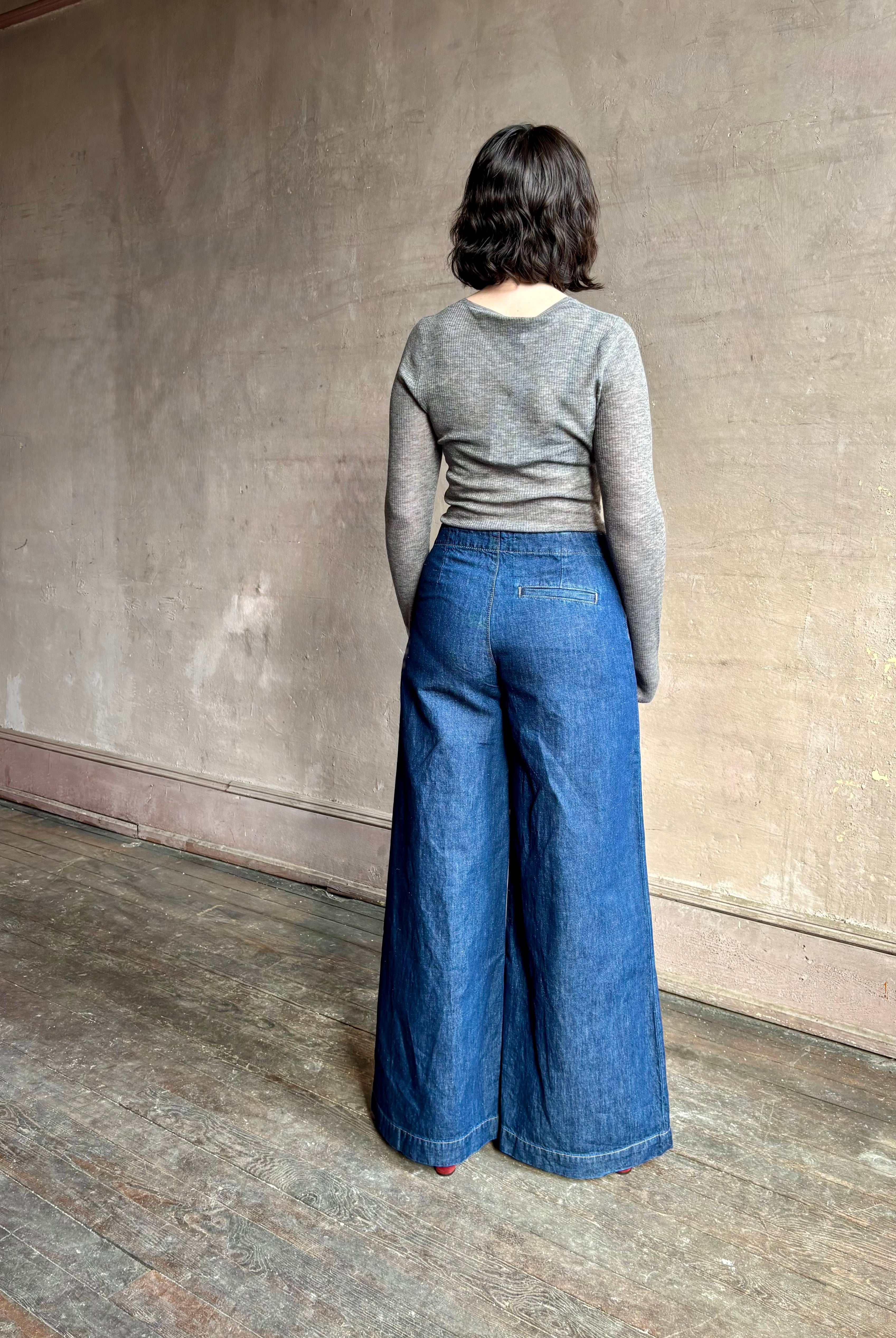 Image of woman wearing designer TWP Dillon cotton linen Denim in Dark Stone wash that is Made in USA with mid-rise and wide leg