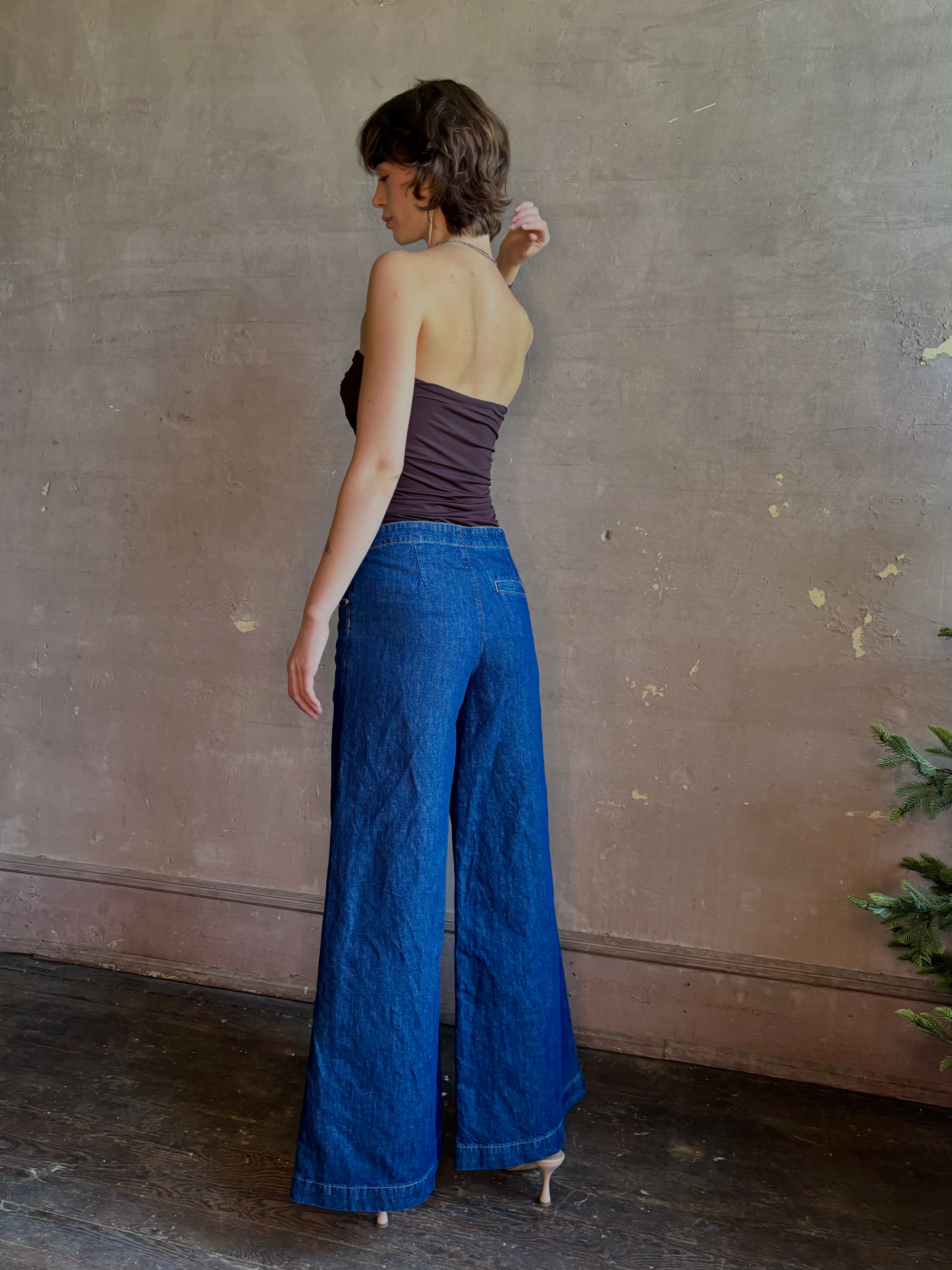 Woman wearing luxury designer TWP Dillon cotton linen Denim in Dark Stone wash that is Made in USA with mid-rise and wide leg