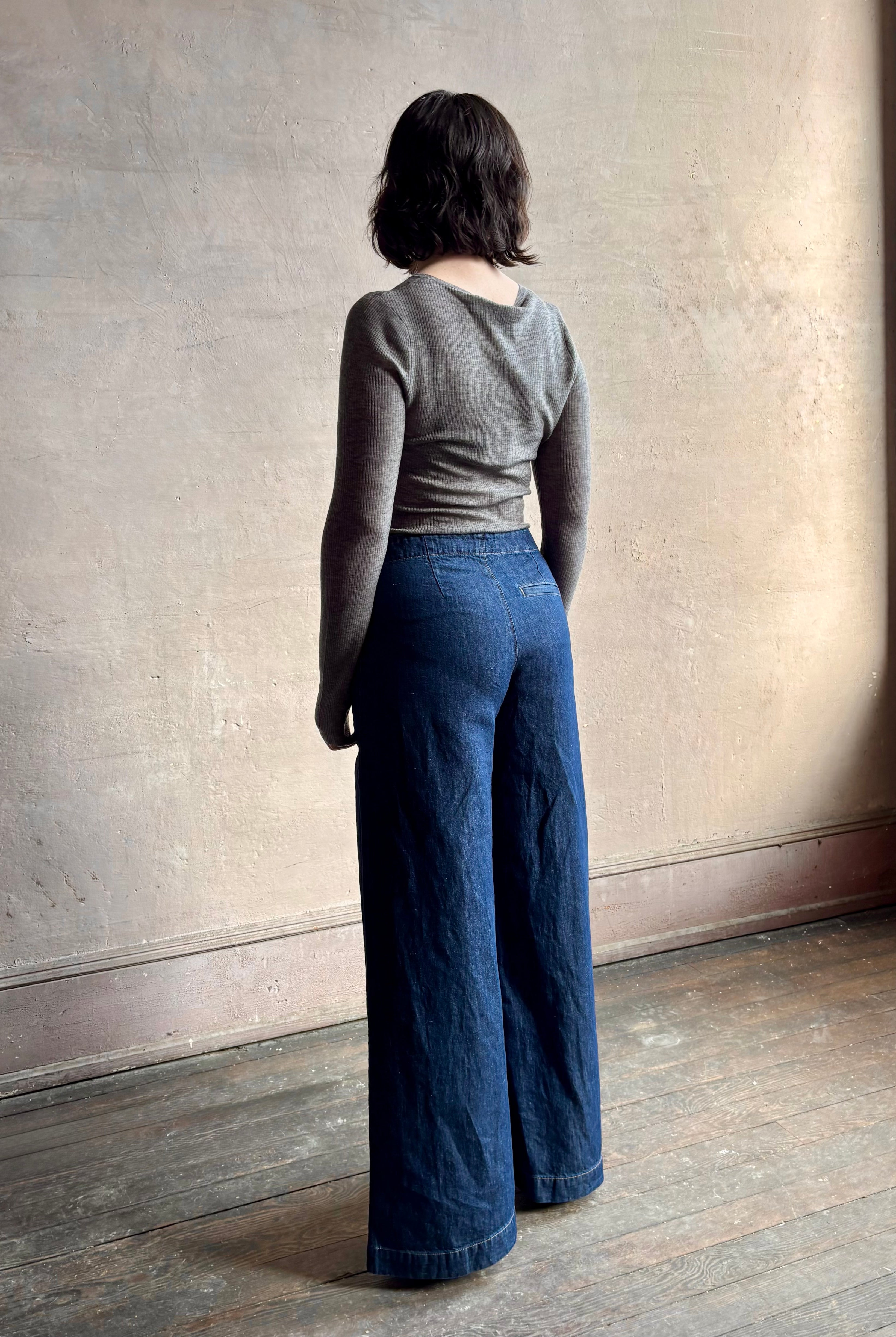 Image of woman wearing designer TWP Dillon cotton linen Denim in Dark Stone wash that is Made in USA with mid-rise and wide leg