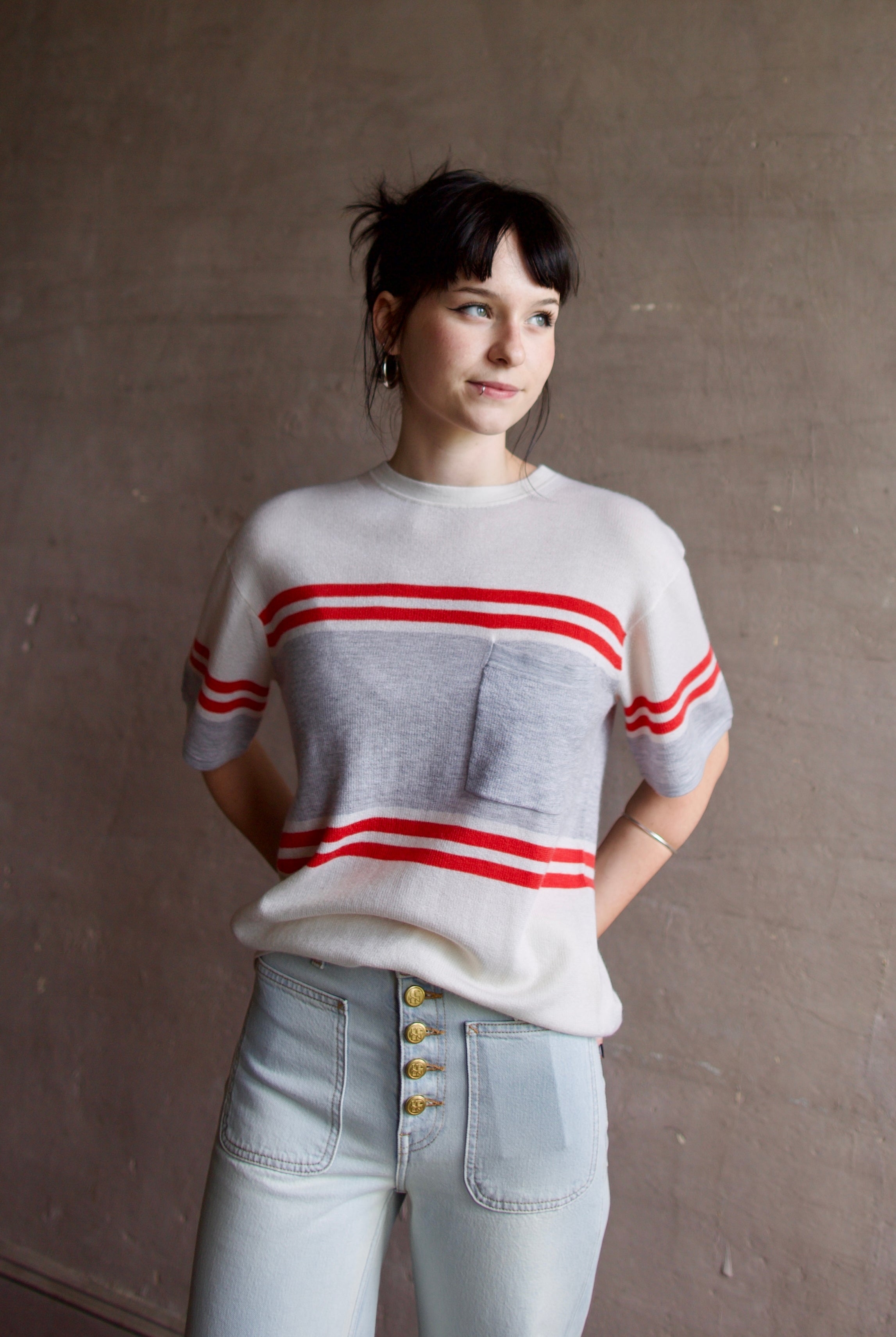 Woman wearing luxury US designer TWP Engineered Striped Big Boy Tee cashmere knit sweater with short sleeves, crew neck and front pocket