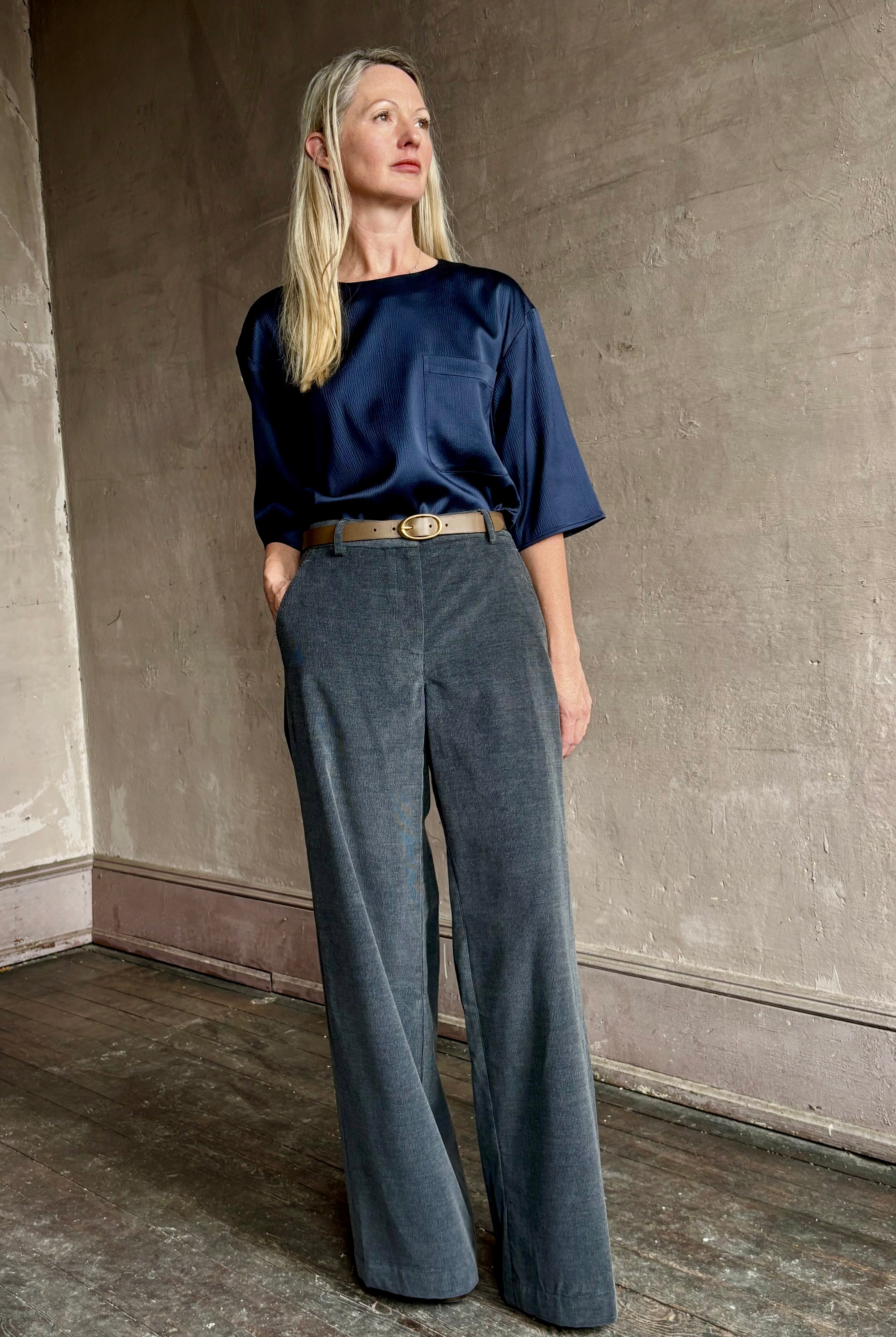 Image of mature woman wearing TWP Ex T in premium hammered satin with short sleeve crew neck and a casual front pocket
