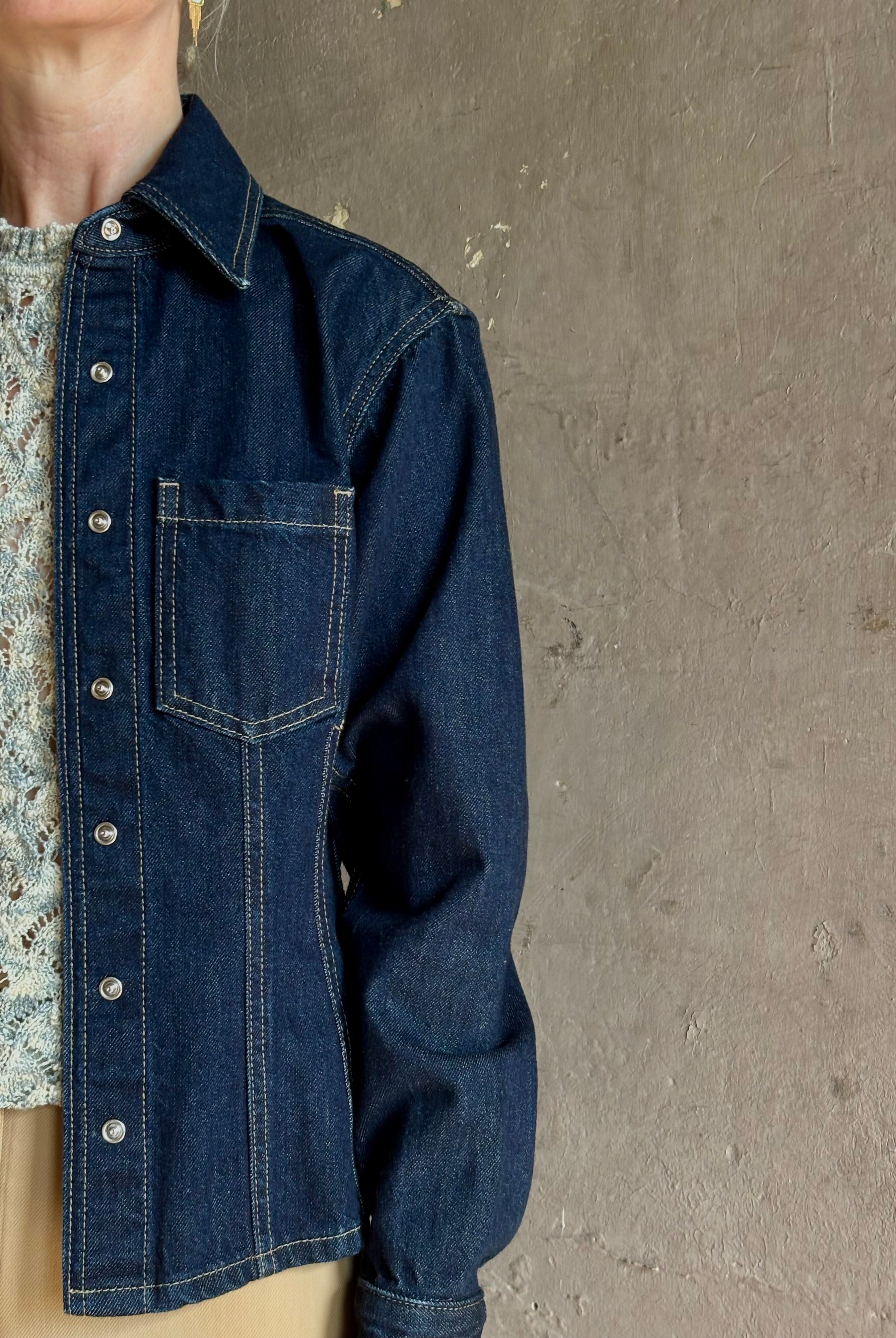 Mature woman wearing Premium Cotton American-Made Denim TWP Franny Shirt with feminine darting silhouette
