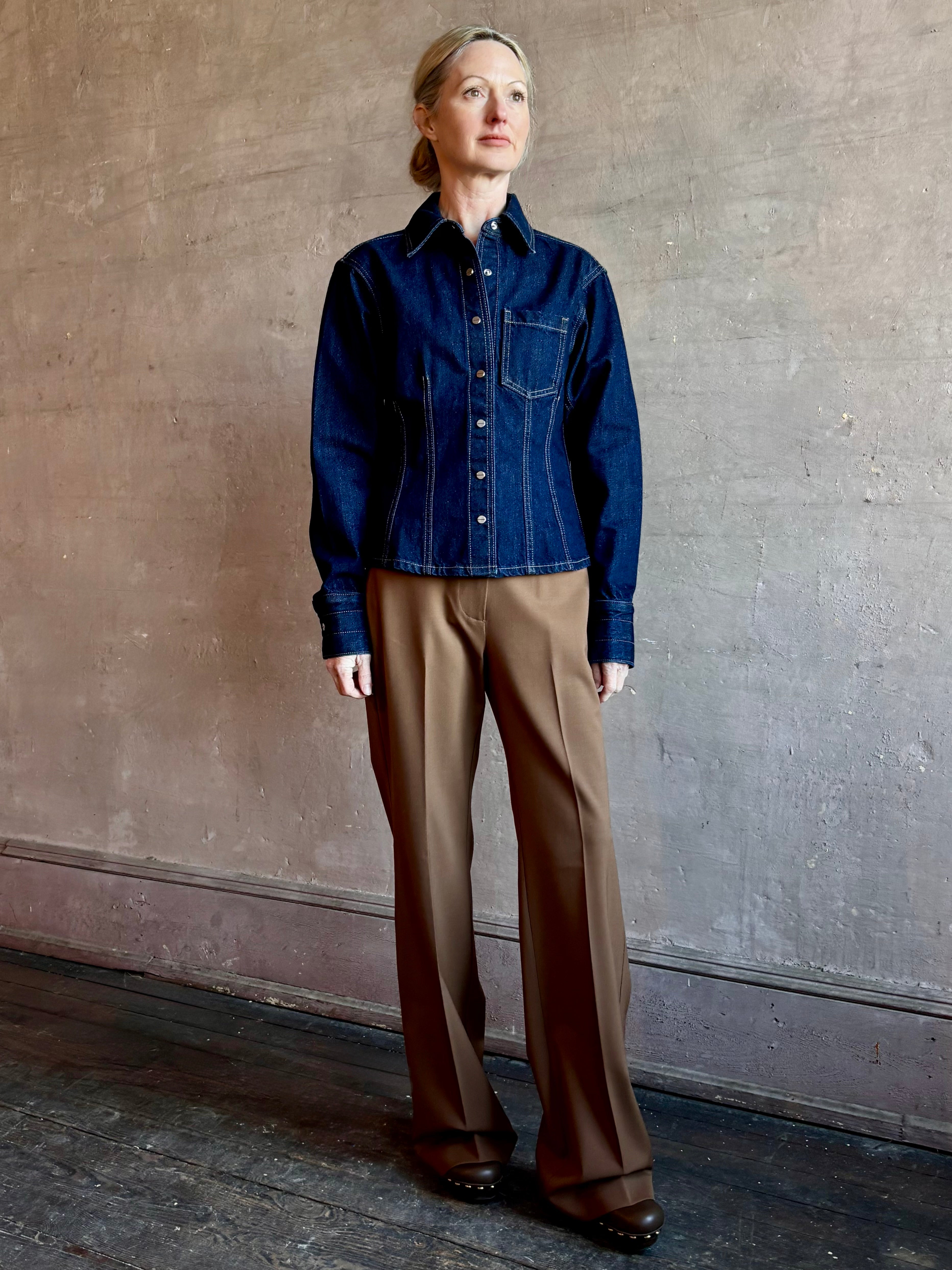Image of woman wearing Premium Cotton American-Made Denim TWP Franny Shirt with feminine darting silhouette at waist