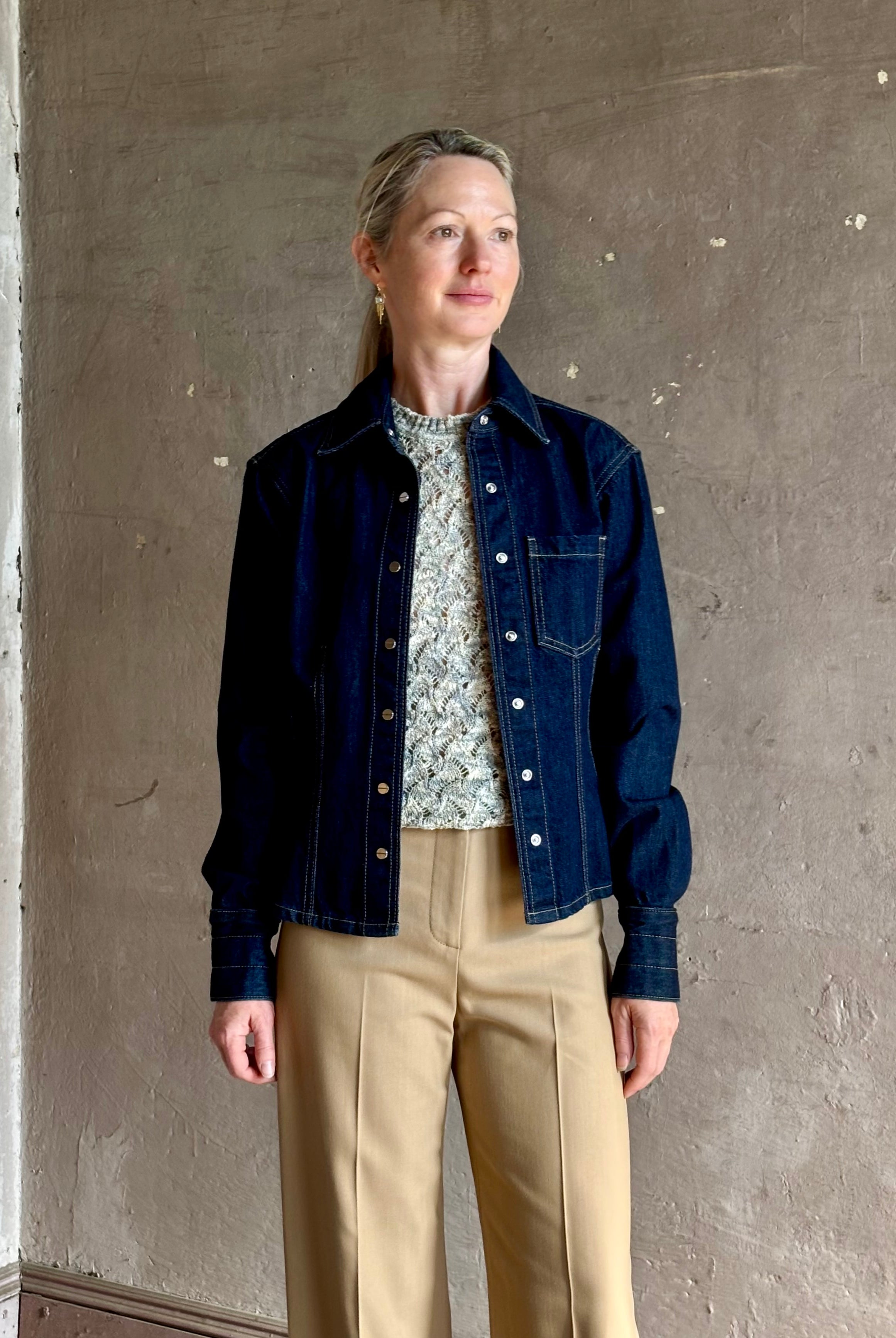 Mature woman wearing Premium Cotton American-Made Denim TWP Franny Shirt with feminine darting silhouette