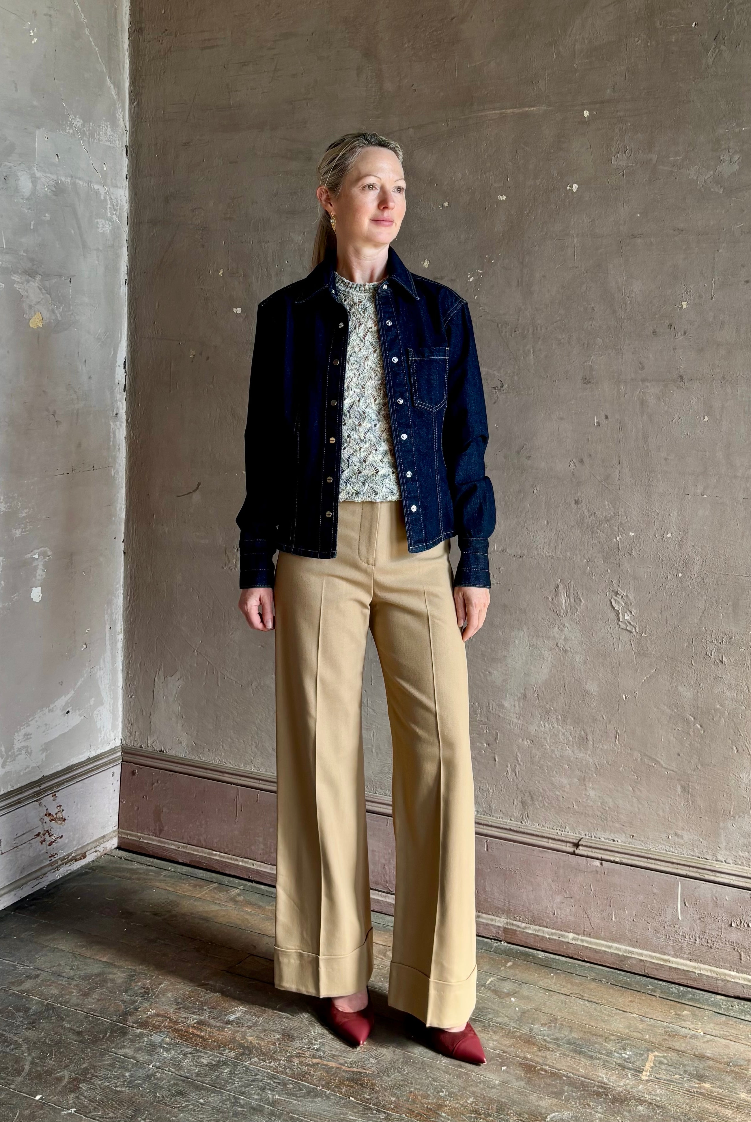 Mature woman wearing Premium Cotton American-Made Denim TWP Franny Shirt with feminine darting silhouette