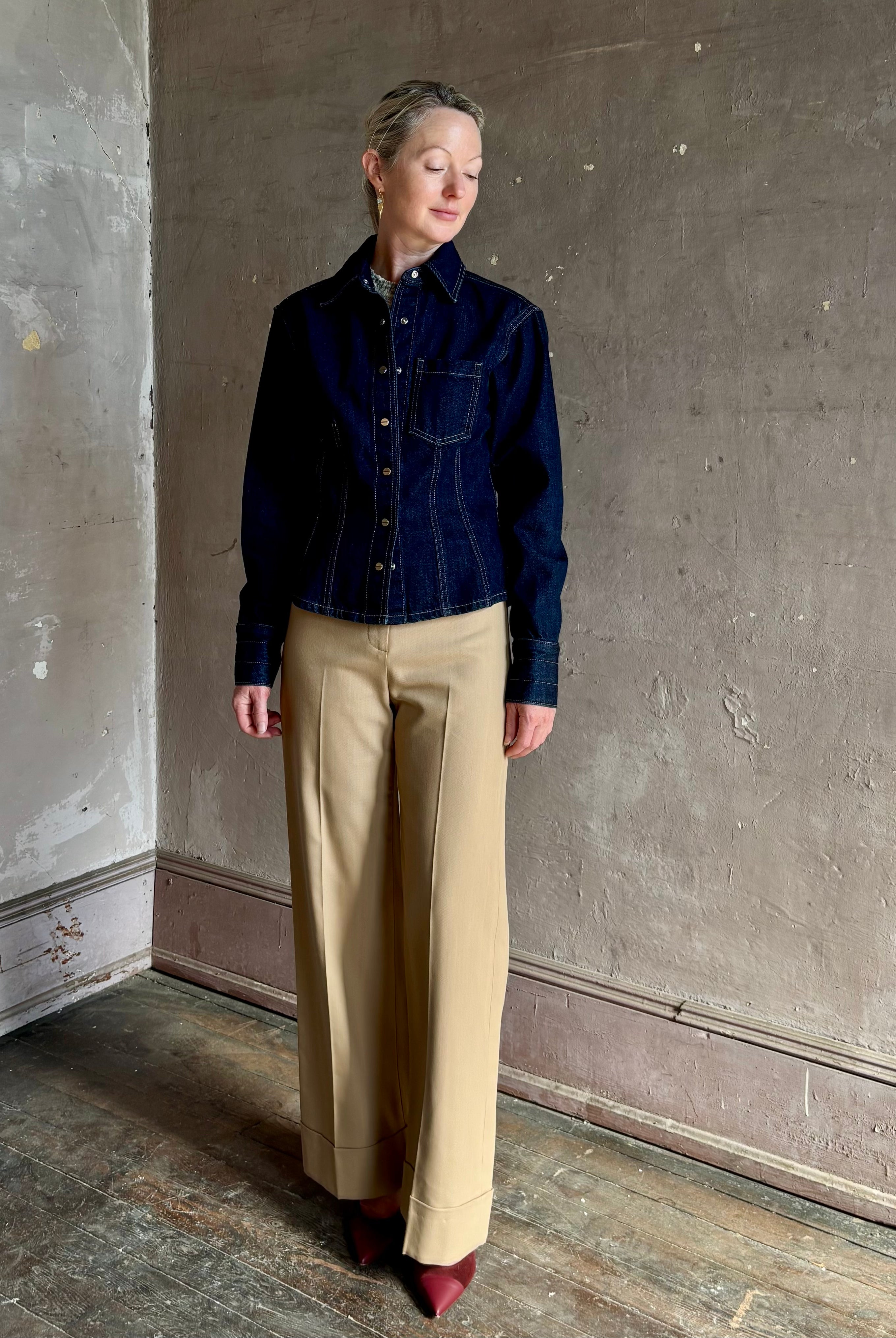 Mature woman wearing Premium Cotton American-Made Denim TWP Franny Shirt with feminine darting silhouette