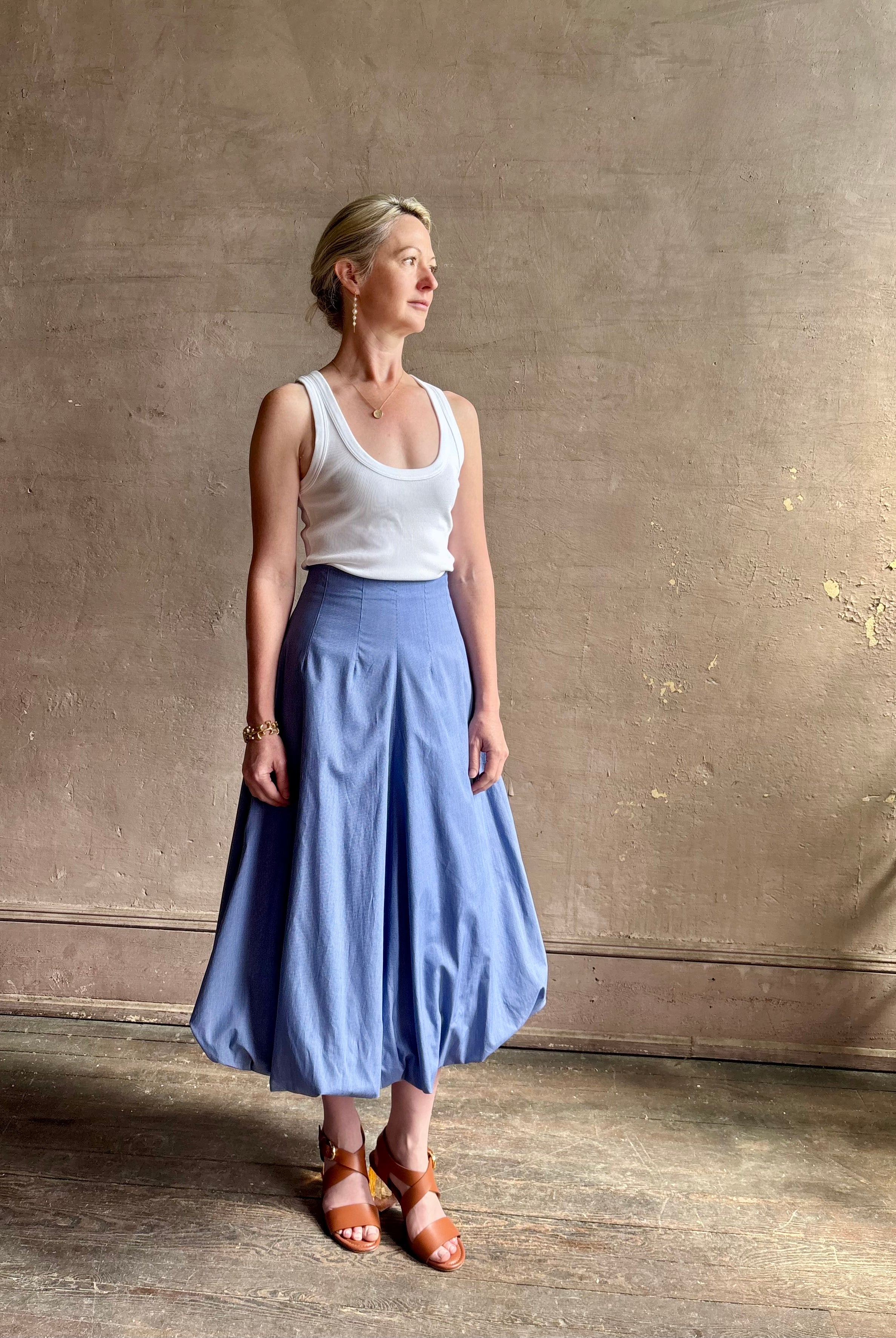 Mature woman wearing American made cotton poplin TWP blue plaid Full Intentions midi bubble Skirt with drop waist