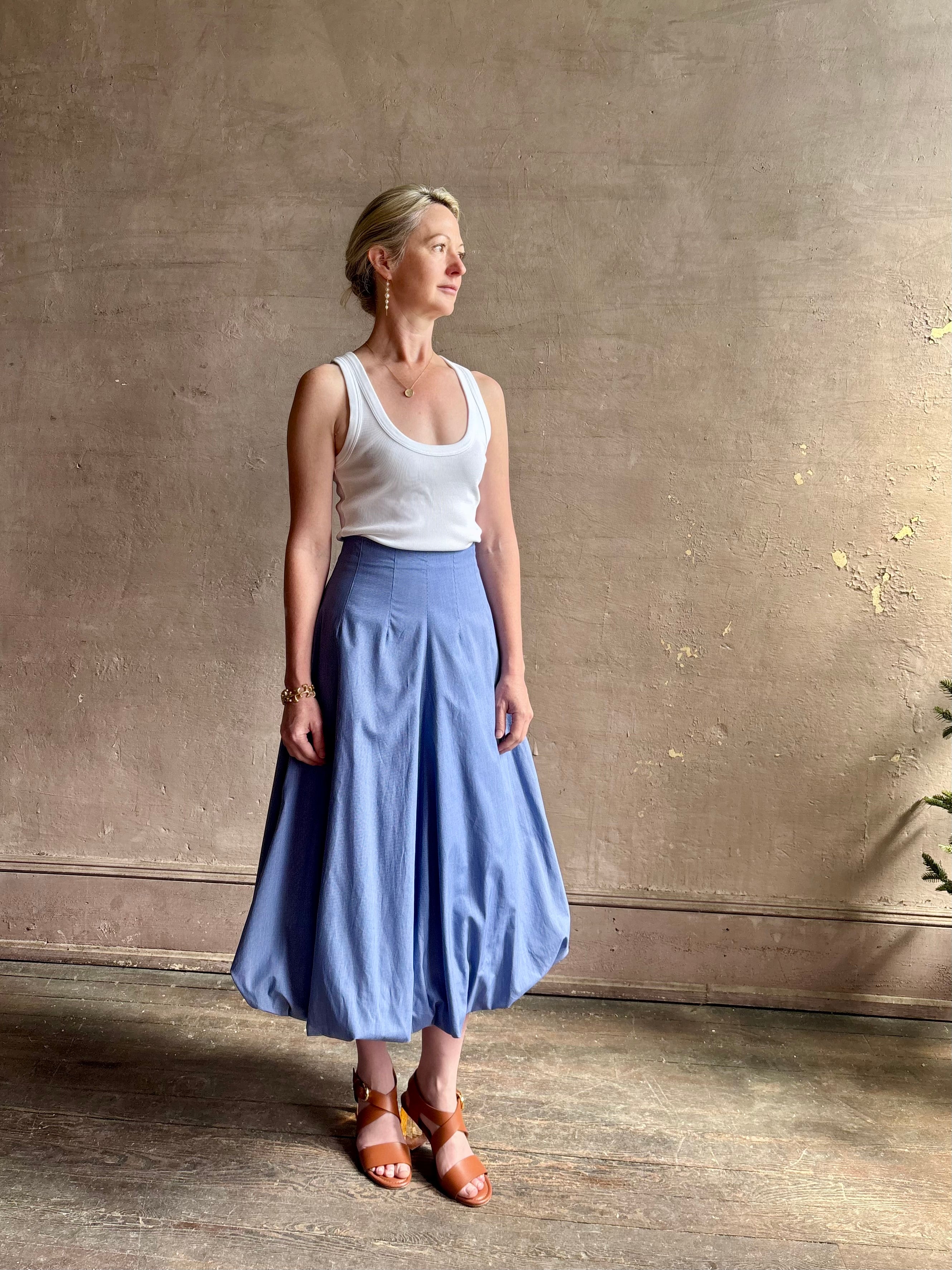 Mature woman wearing American made cotton poplin TWP blue plaid Full Intentions midi bubble Skirt with drop waist