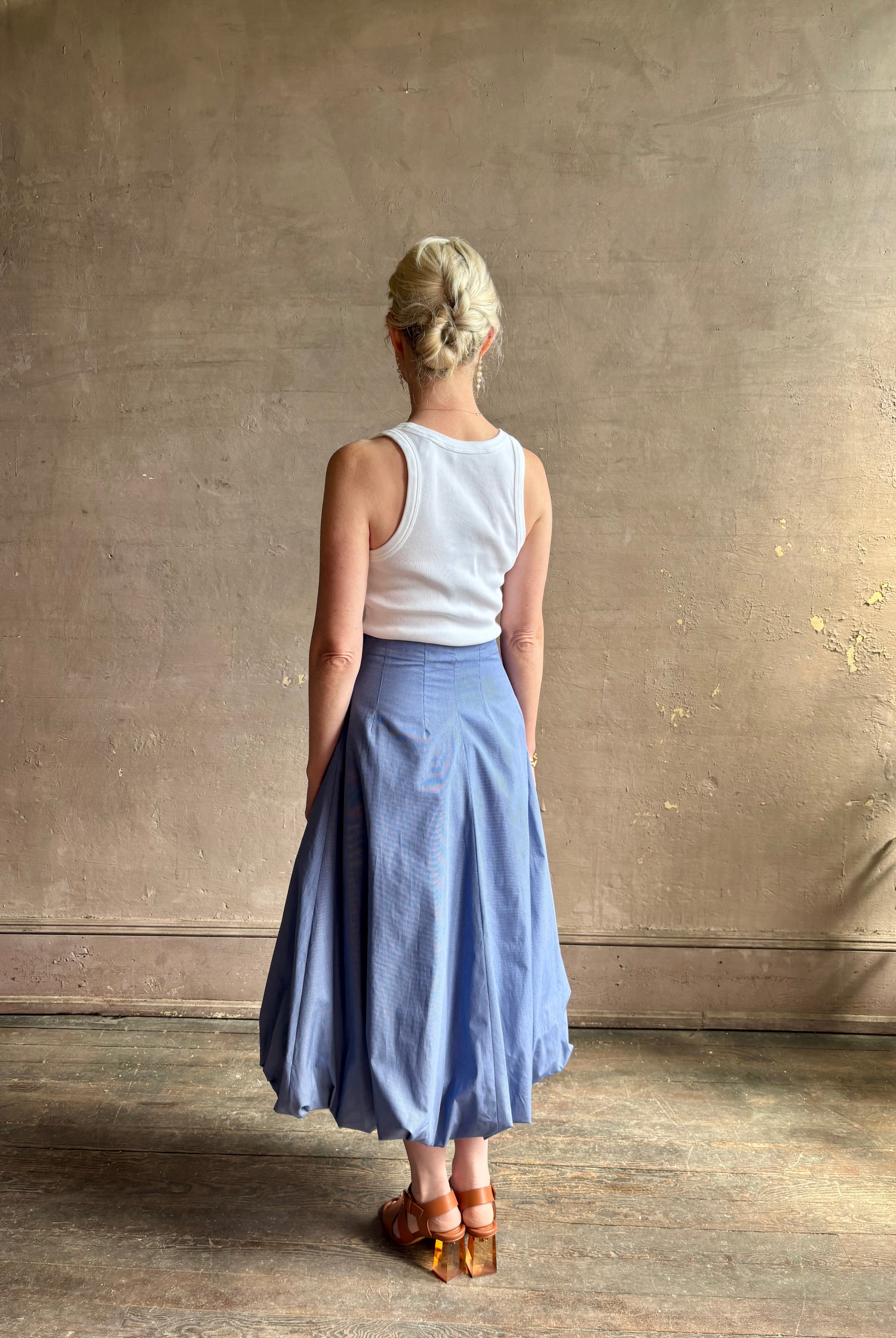 Mature woman wearing American made cotton poplin TWP blue plaid Full Intentions midi bubble Skirt with drop waist