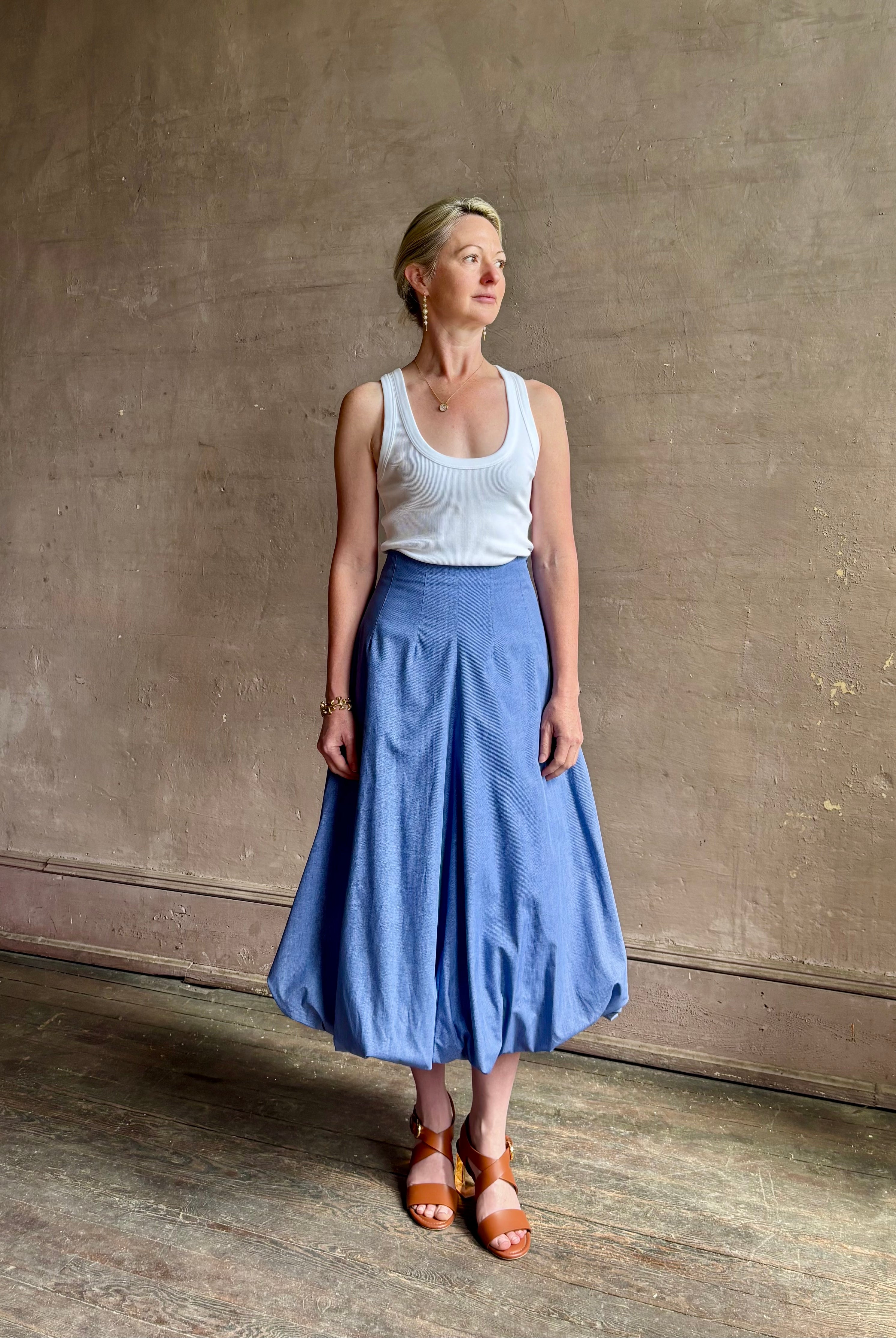 Mature woman wearing American made cotton poplin TWP blue plaid Full Intentions midi bubble Skirt with drop waist