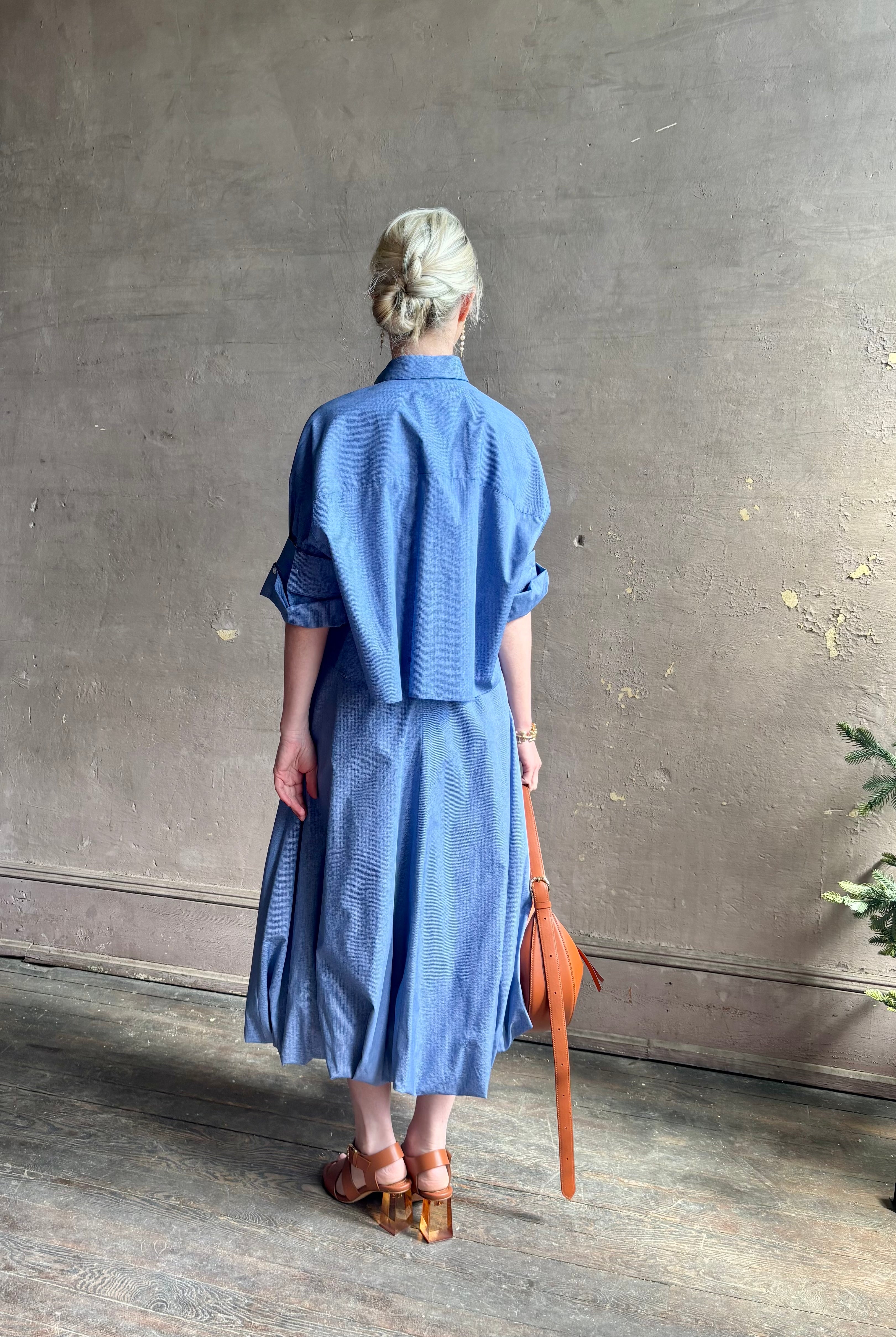 Mature woman wearing American made cotton poplin TWP blue plaid Full Intentions midi bubble Skirt with drop waist