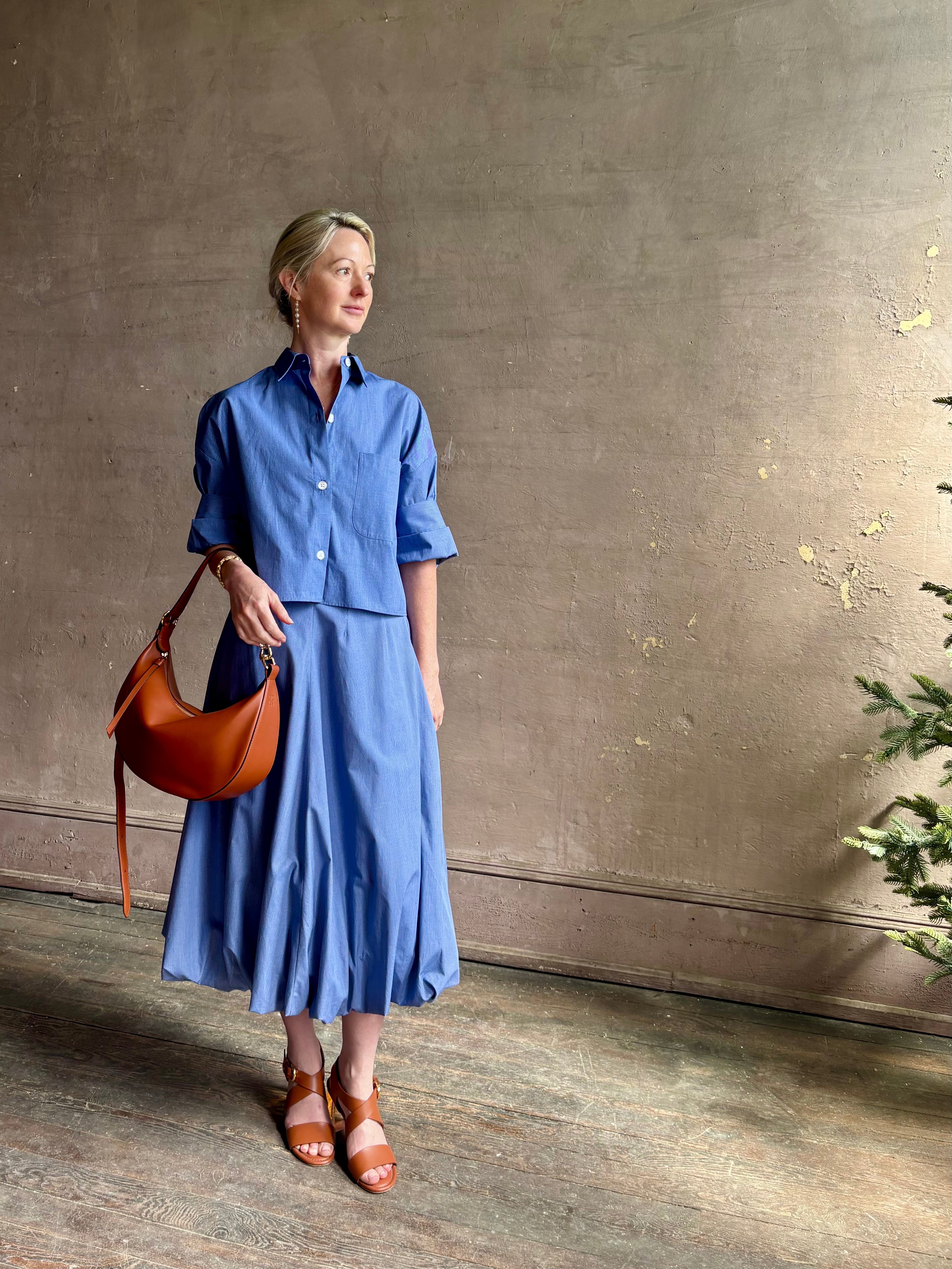 Mature woman wearing American made cotton poplin TWP blue plaid Full Intentions midi bubble Skirt with drop waist