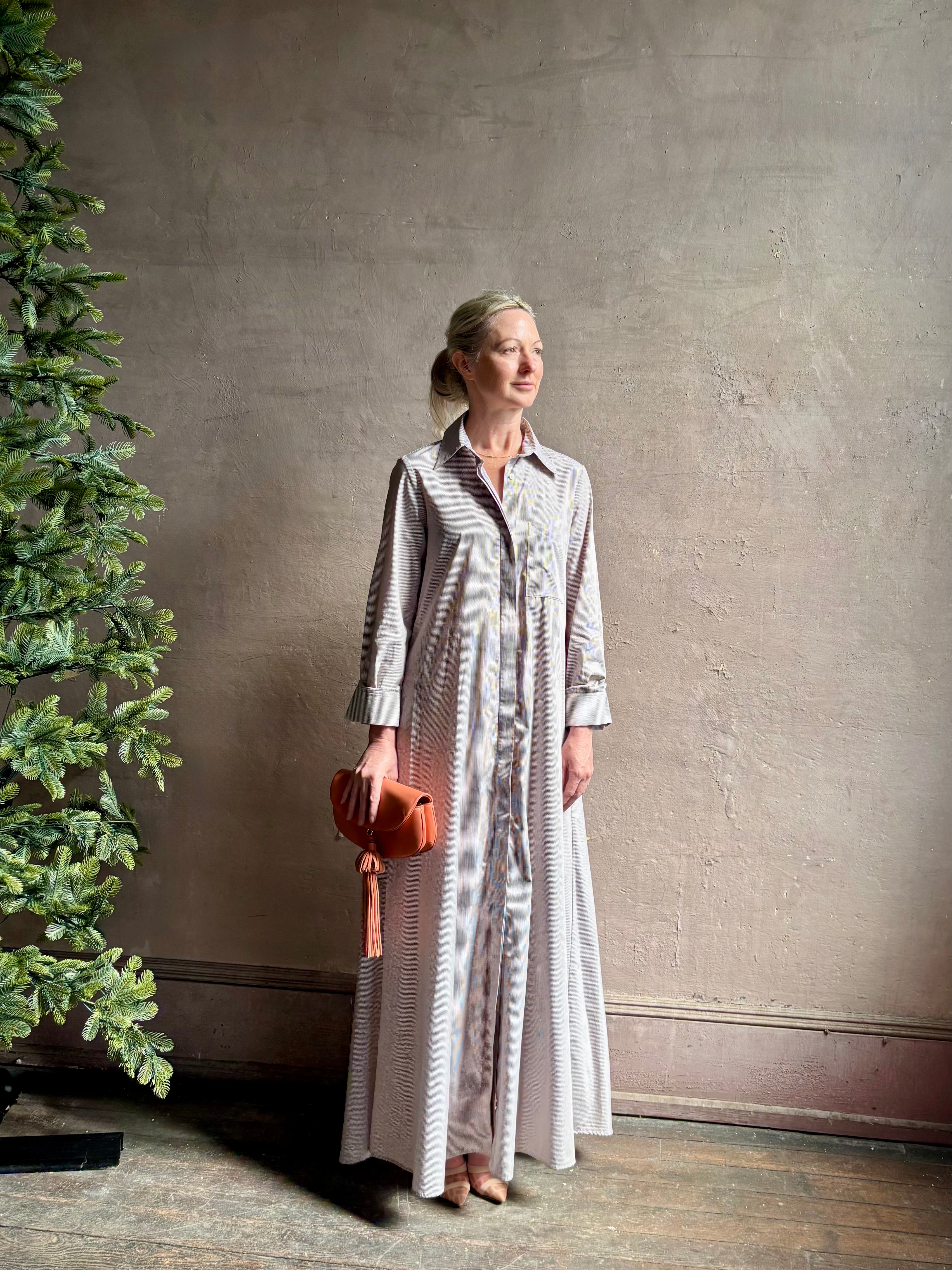 Mature woman wearing luxury TWP Jenny's Gown in Brown Stripe effortless sophistication in a comfortable premium cotton