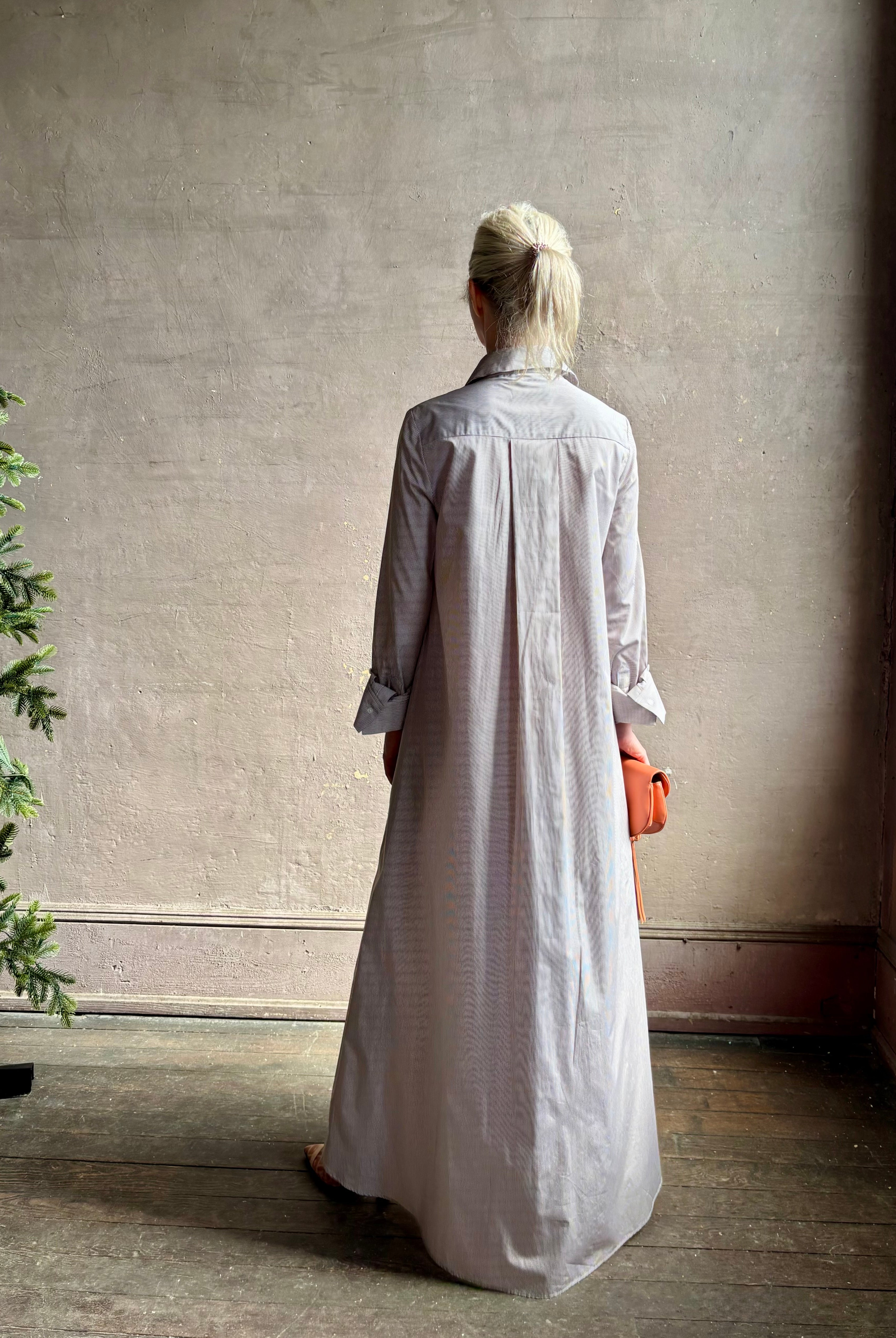 Mature woman wearing luxury TWP Jenny's Gown in Brown Stripe effortless sophistication in a comfortable premium cotton
