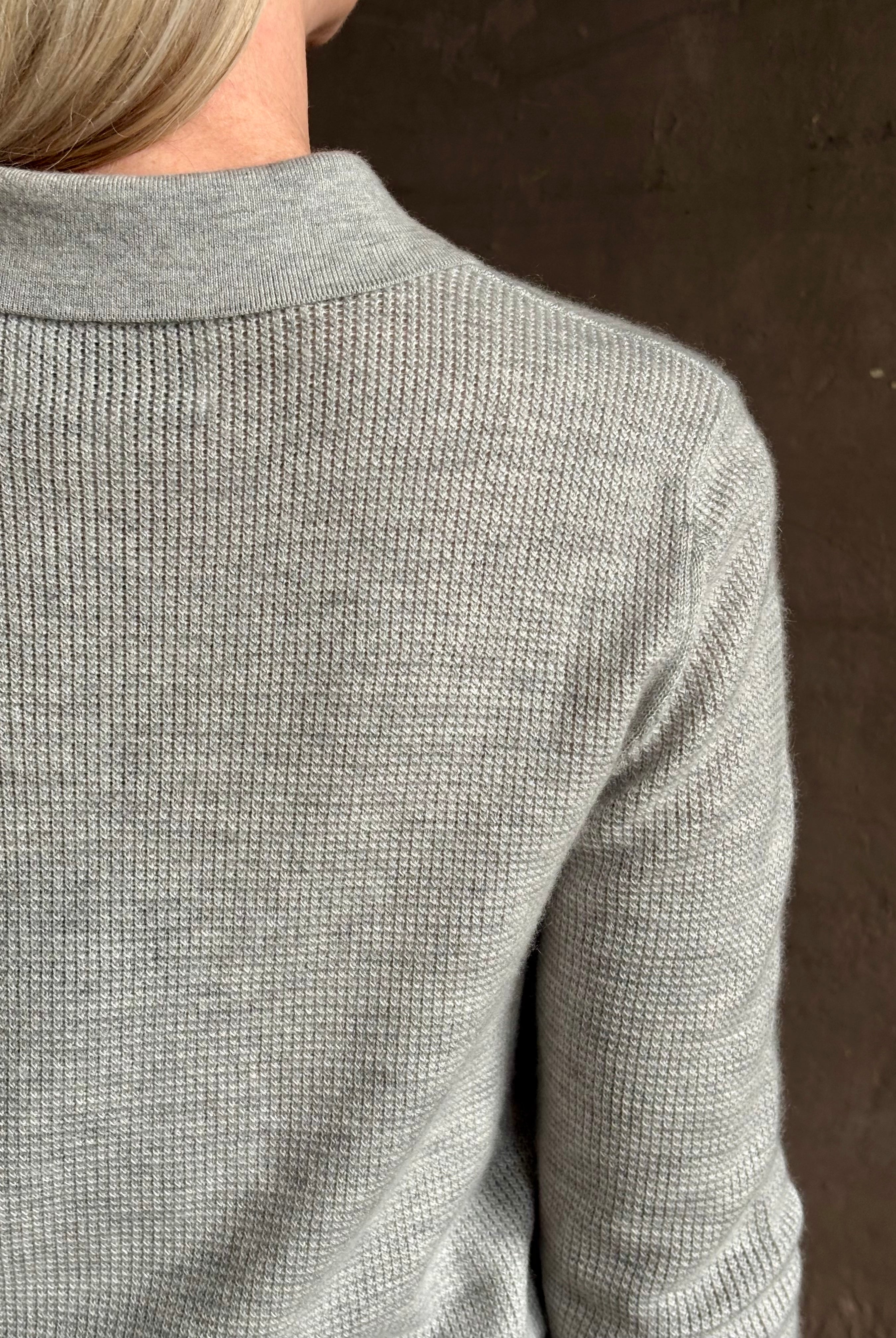 woman wearing light heather grey TWP Jorden Polo Henley premium cashmere elevated casual wear comfy long sleeve