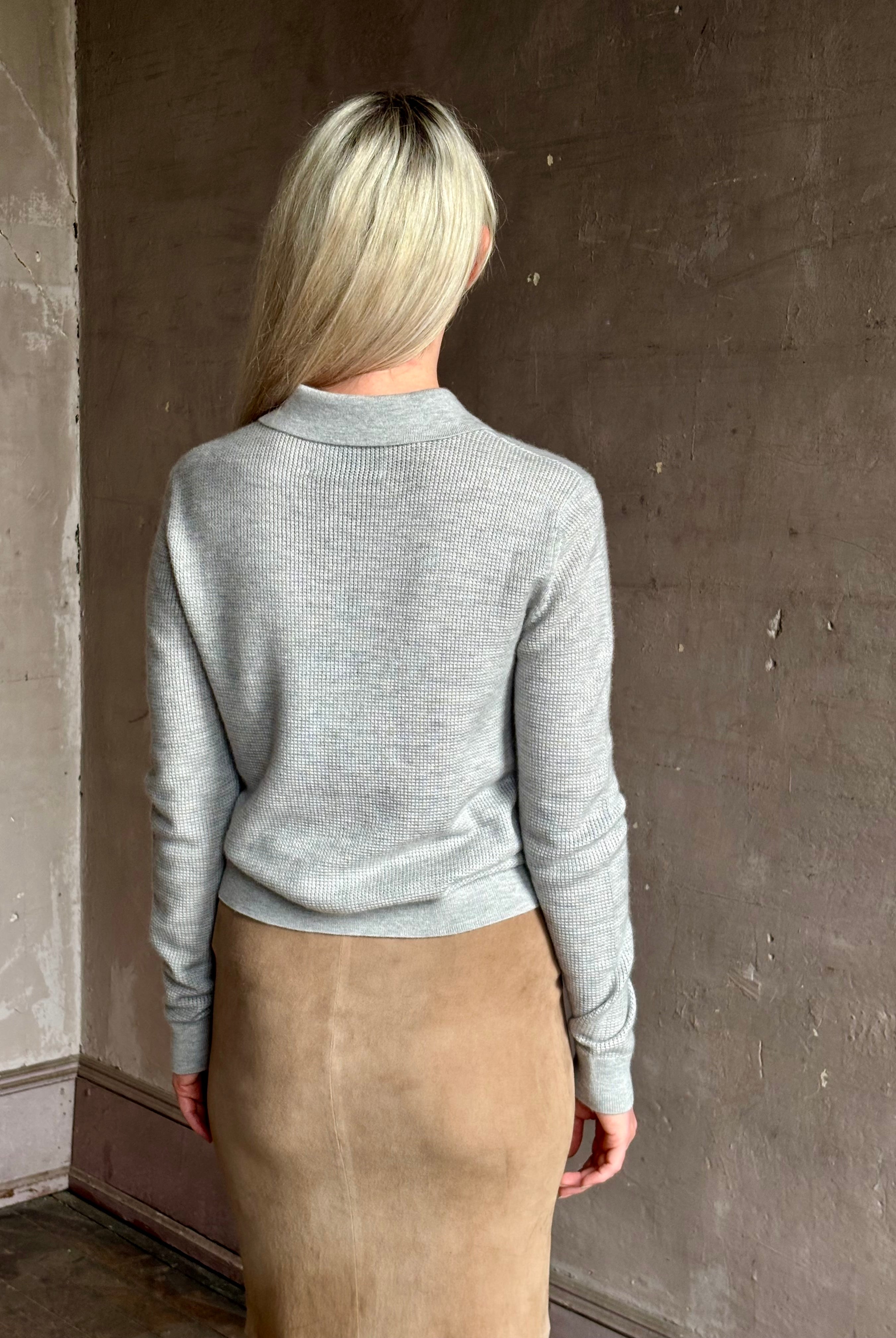 woman wearing light heather grey TWP Jorden Polo Henley premium cashmere elevated casual wear comfy long sleeve