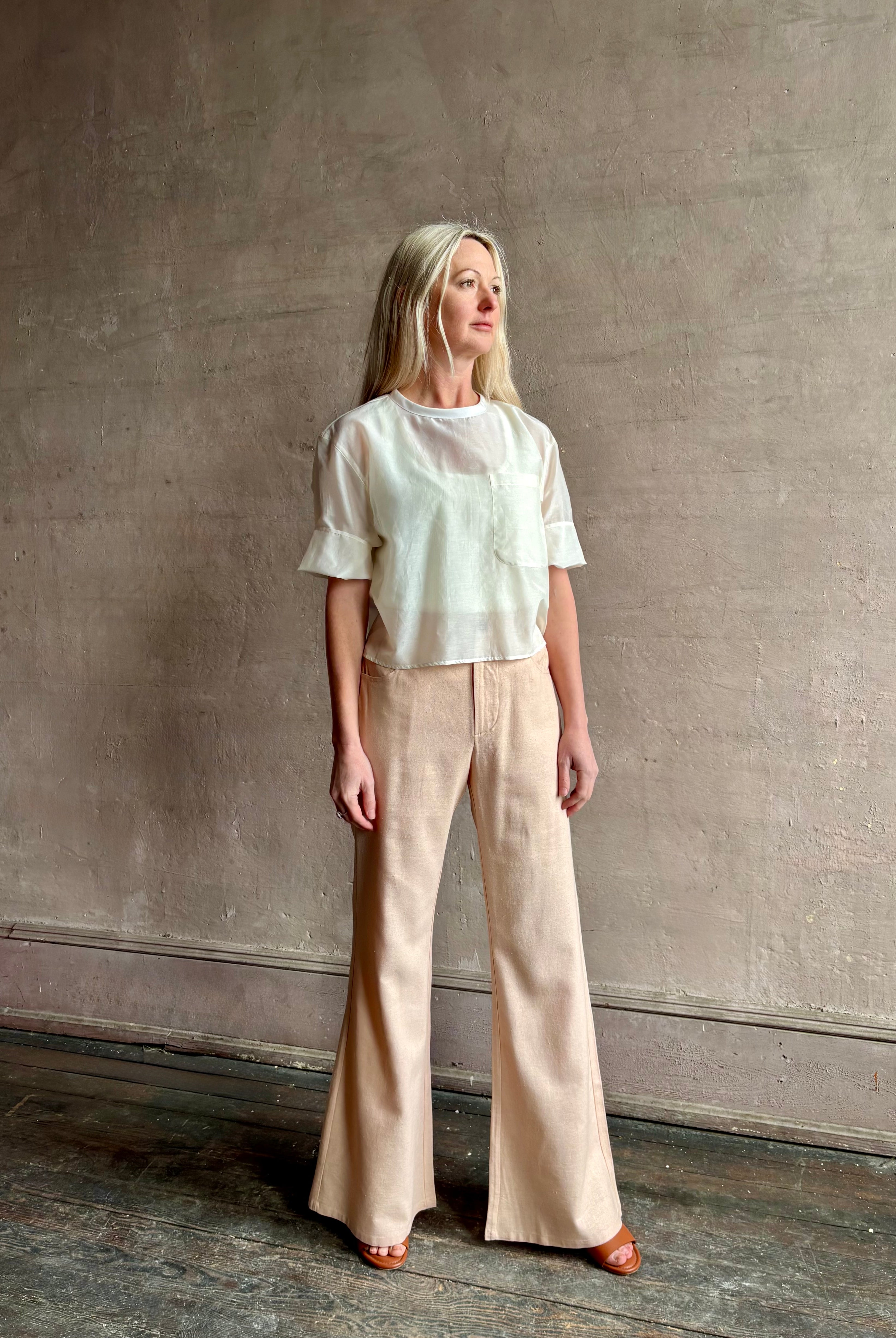 Mature woman wearing TWP New Ex T top in an Ivory lightweight cotton silk blend with short sleeves crew neck
