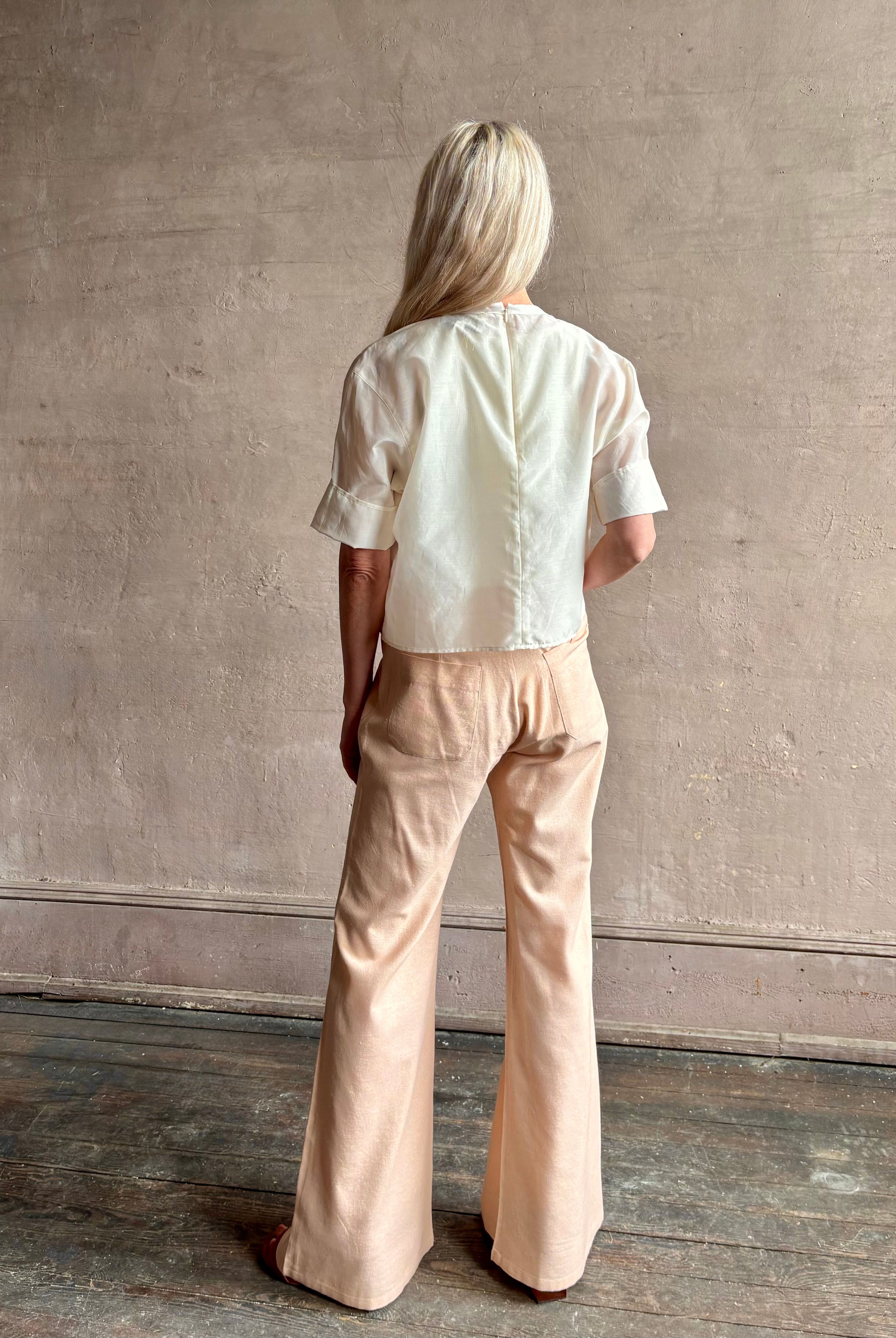 Mature woman wearing TWP New Ex T top in an Ivory lightweight cotton silk blend with short sleeves crew neck
