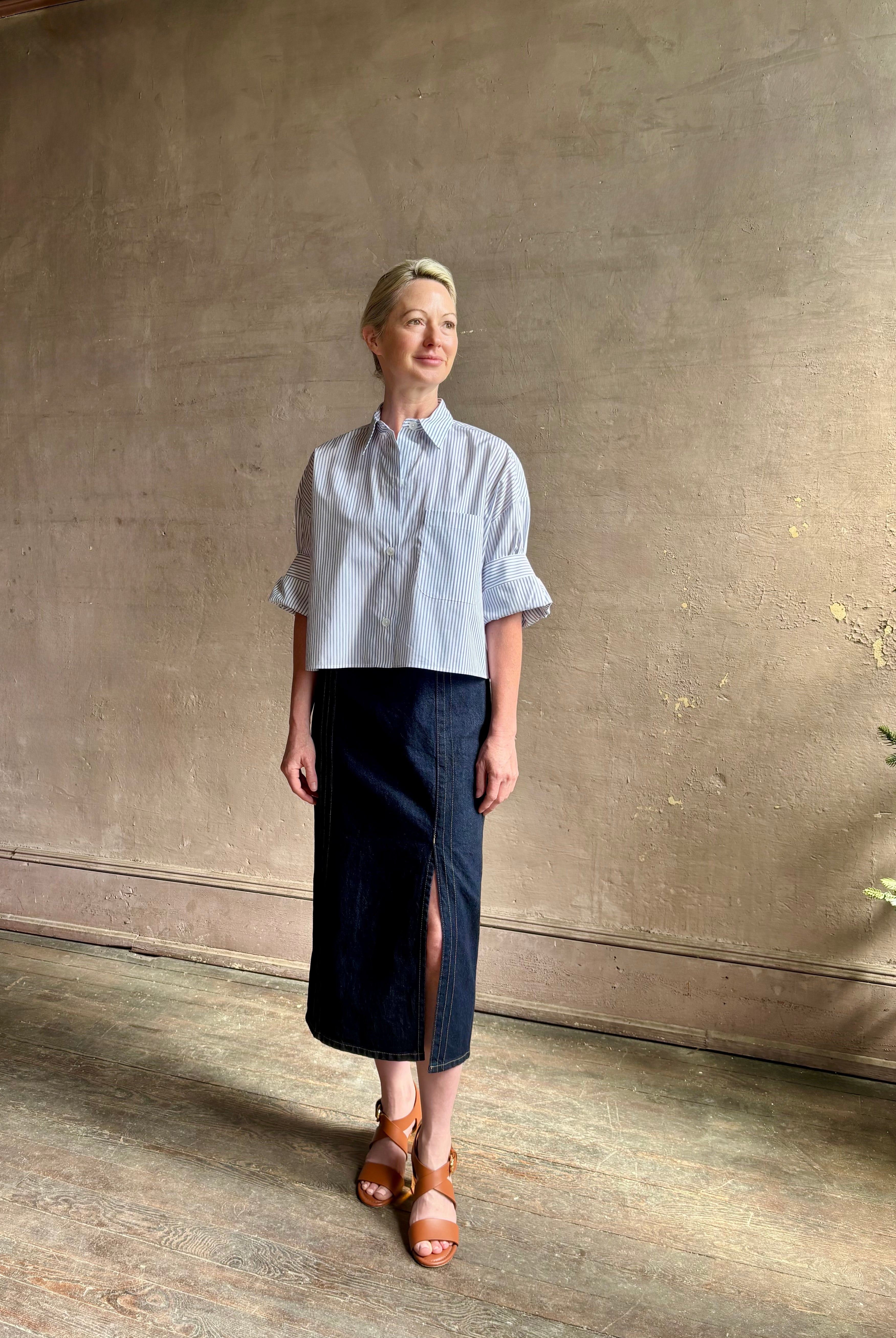 Woman wearing luxury cotton poplin TWP Next EX Shirt White and navy stripe with collar button front made in USA