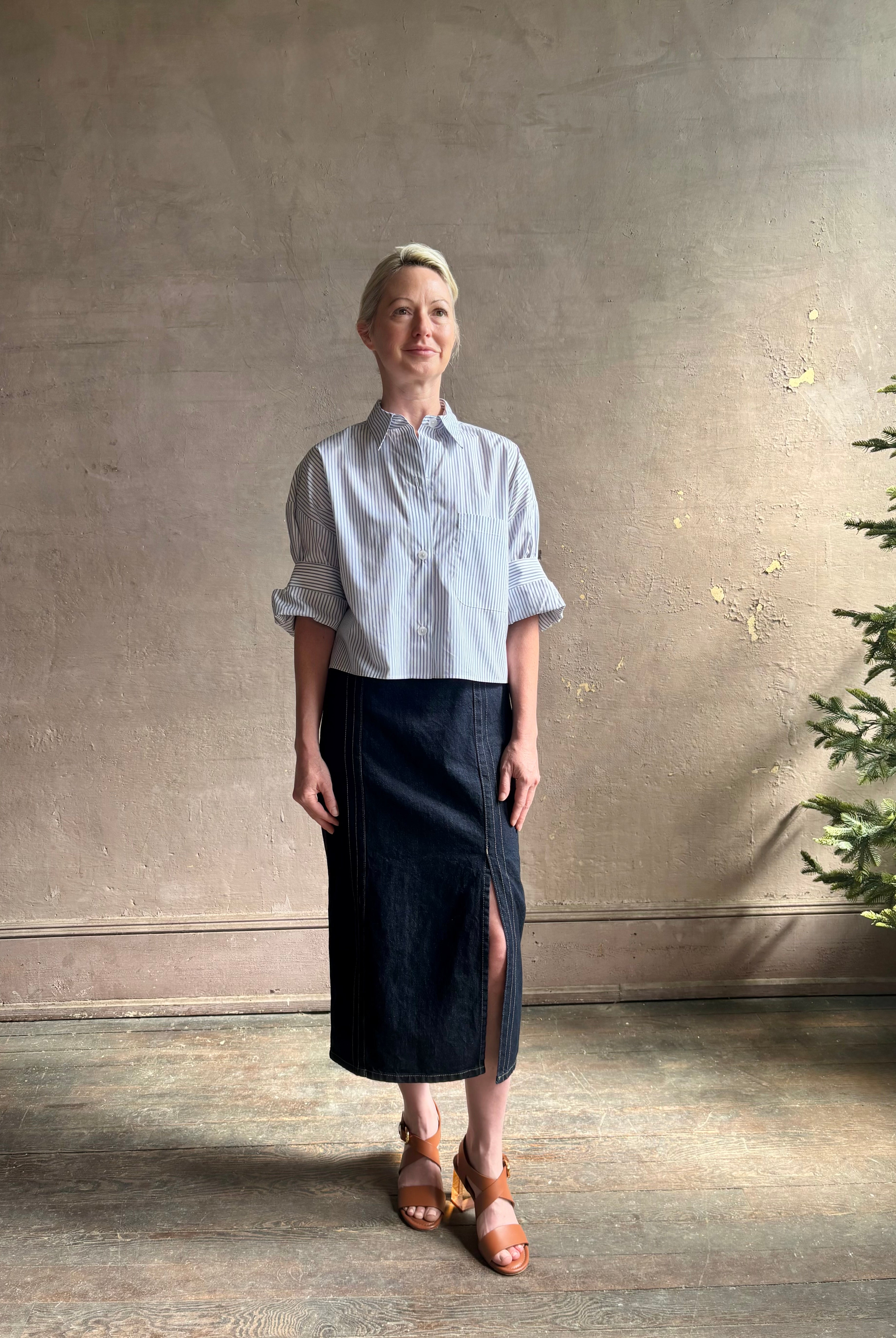 Woman wearing luxury cotton poplin TWP Next EX Shirt White and navy stripe with collar button front made in USA