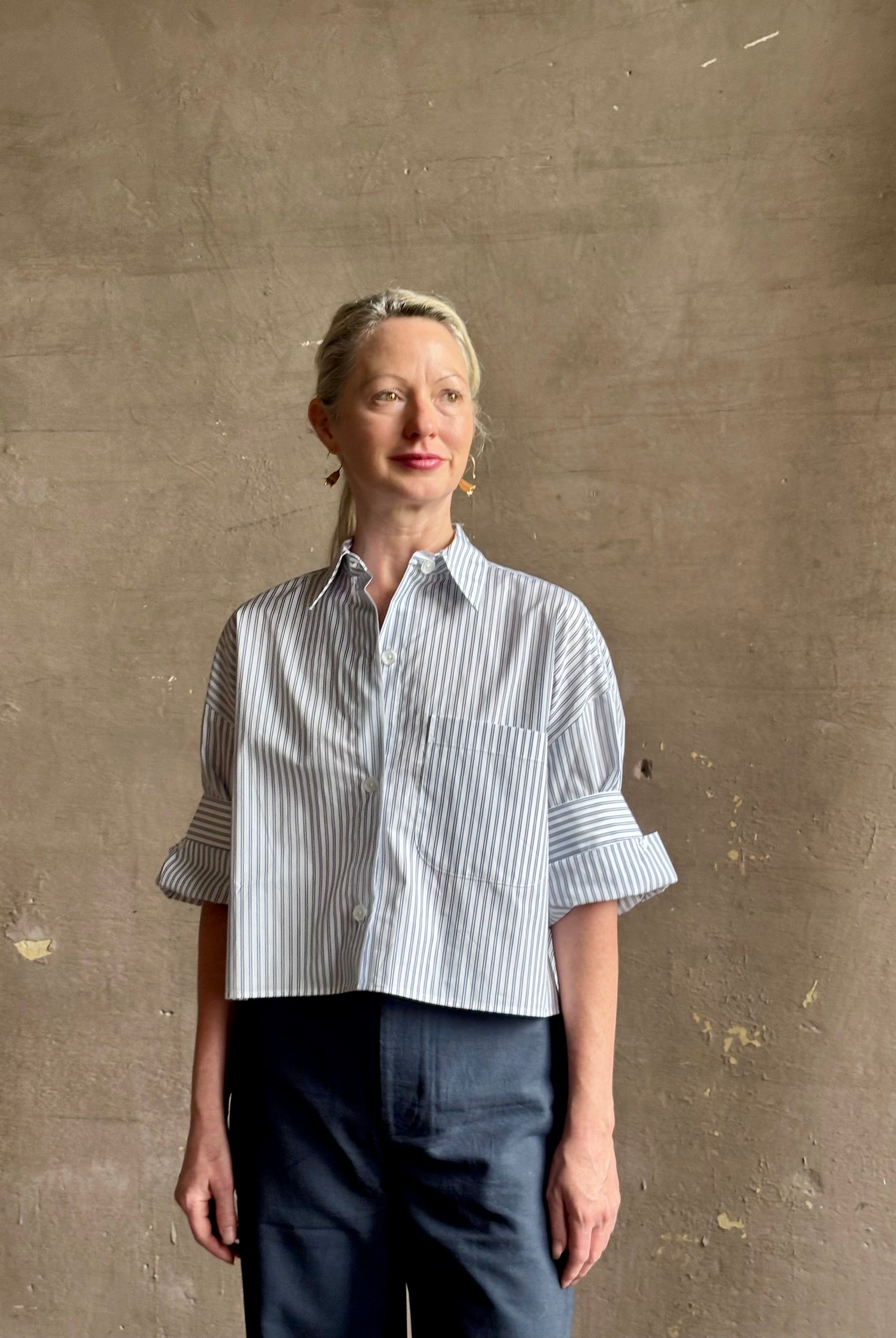 Mature woman wearing TWP next Ex cotton poplin shirt button front striped blue and white collar tailored cuffs