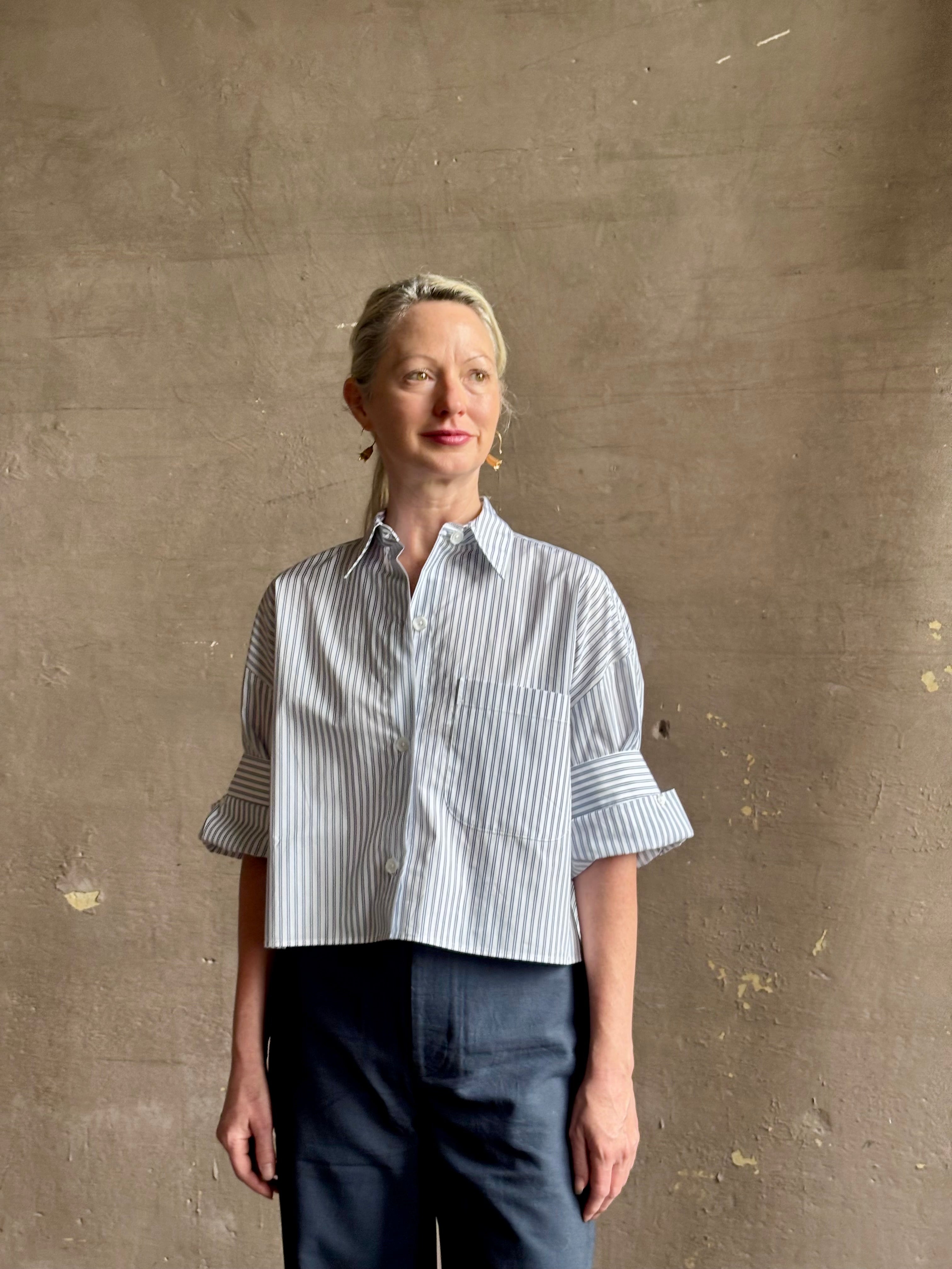 Mature woman wearing TWP next Ex cotton poplin shirt button front striped blue and white collar tailored cuffs